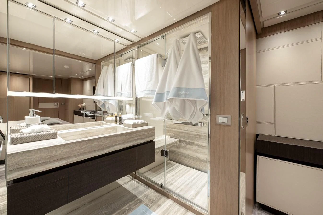 a bathroom with a glass shower aboard INSIEME Yacht for Sale
