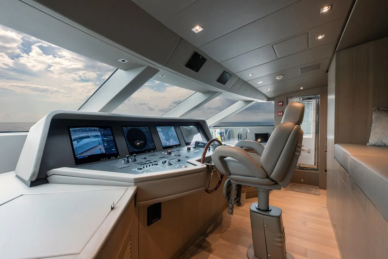 a room with a desk and chairs aboard INSIEME Yacht for Sale