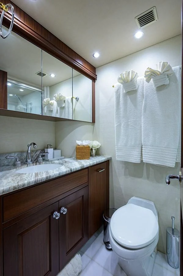 a bathroom with a toilet and a sink aboard ROBINSON CRUSOE Yacht for Sale