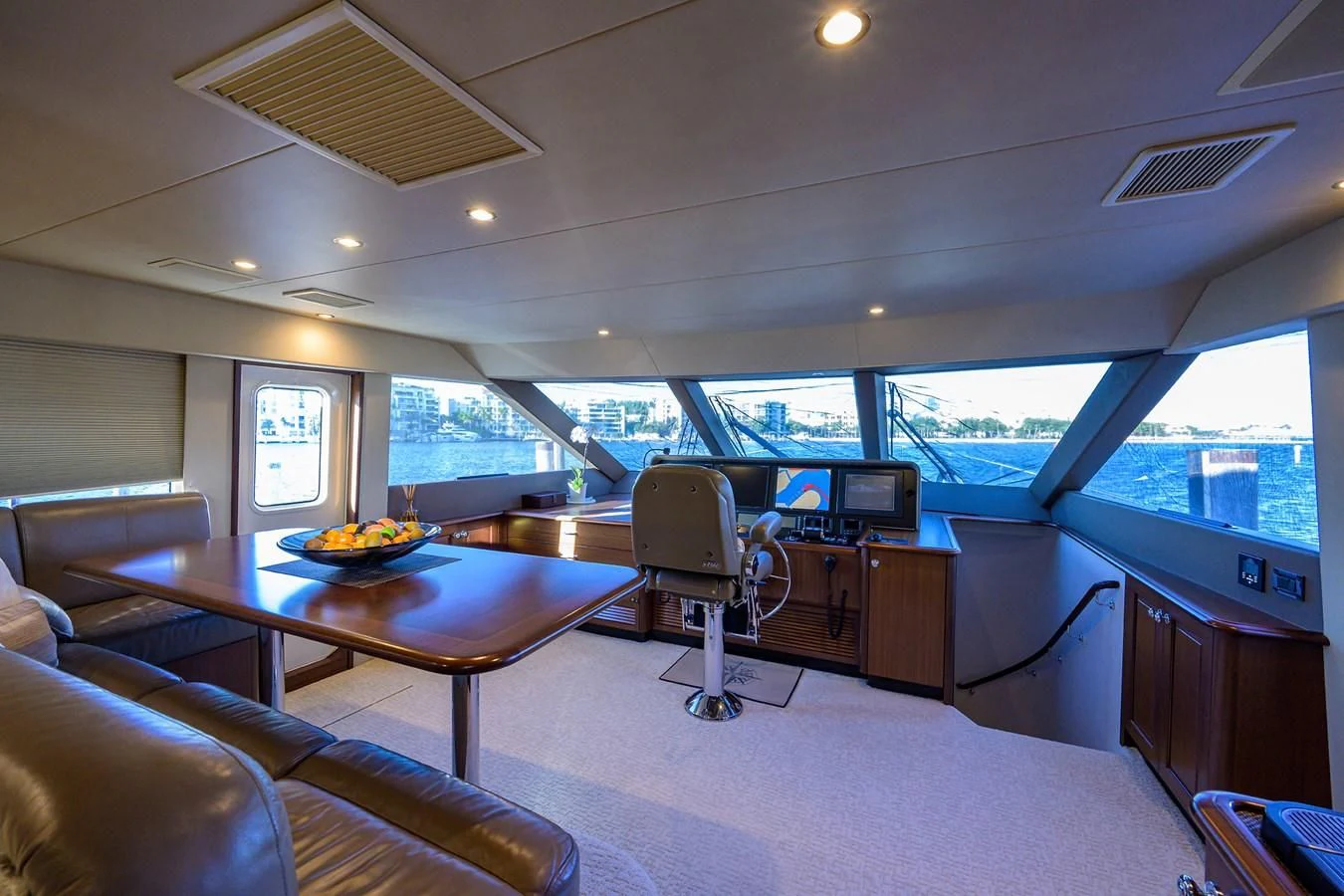 a room with a table and chairs aboard ROBINSON CRUSOE Yacht for Sale