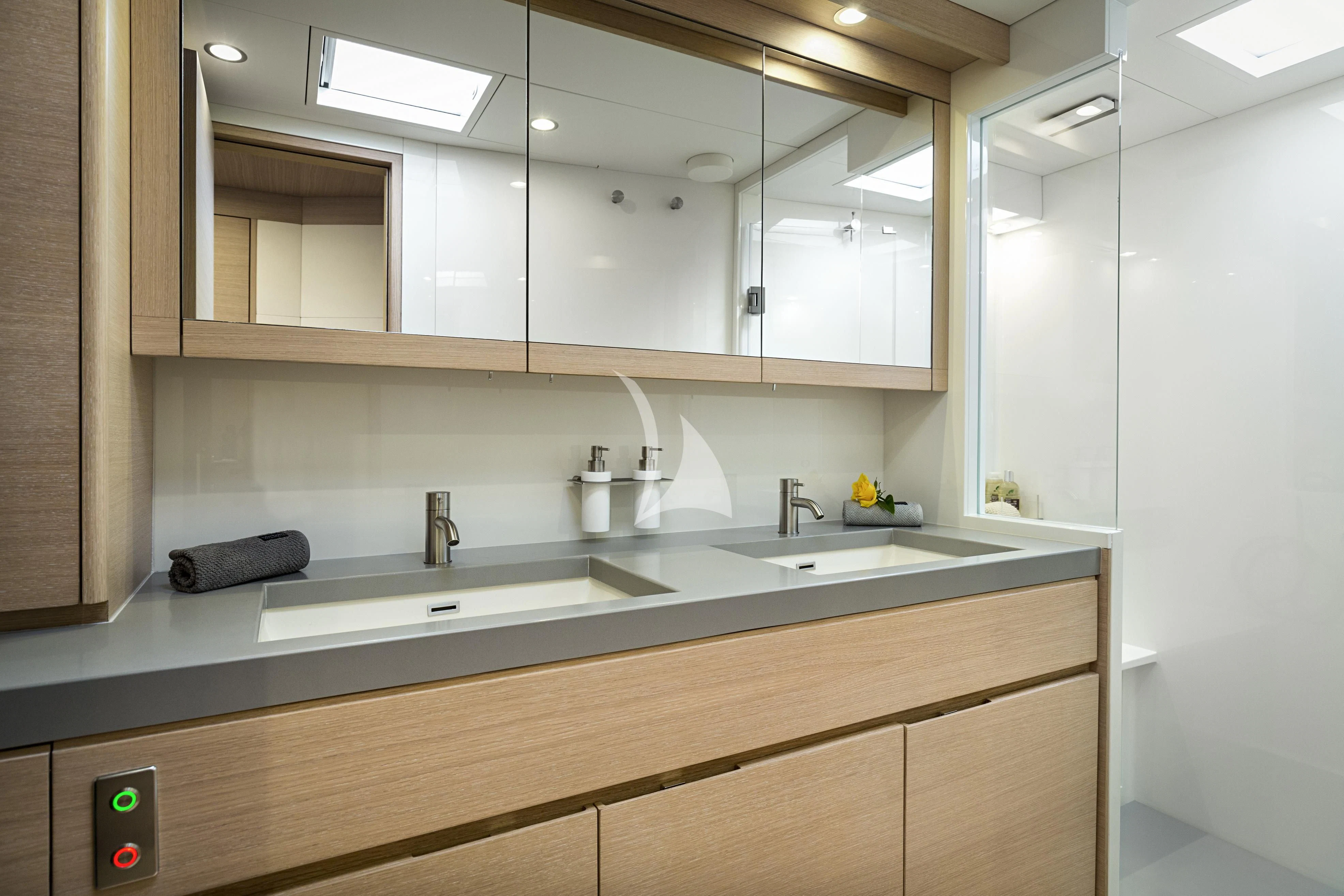 a kitchen with a sink and cabinets aboard AMMONITE Yacht for Charter