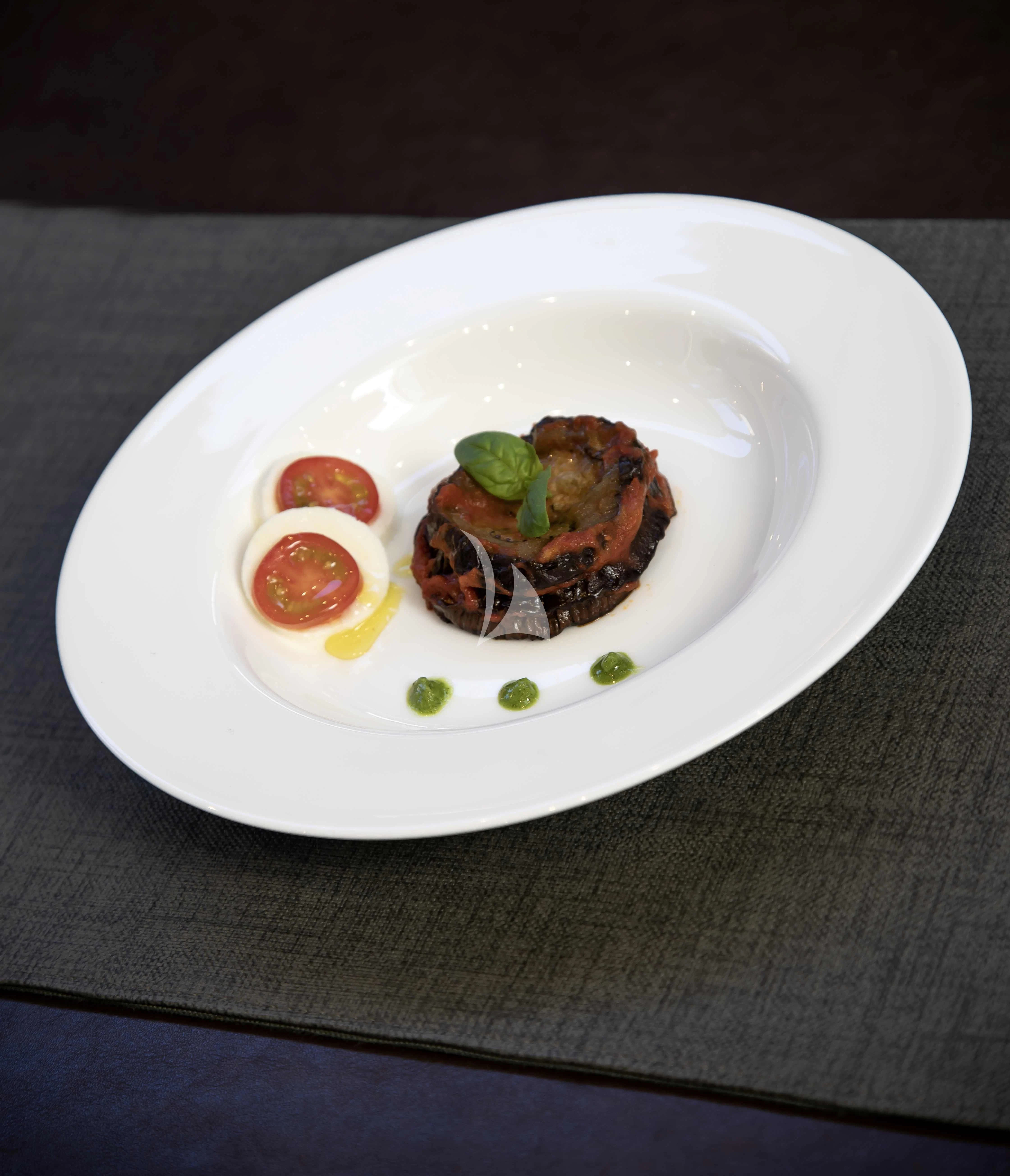 a plate of food aboard AMMONITE Yacht for Charter