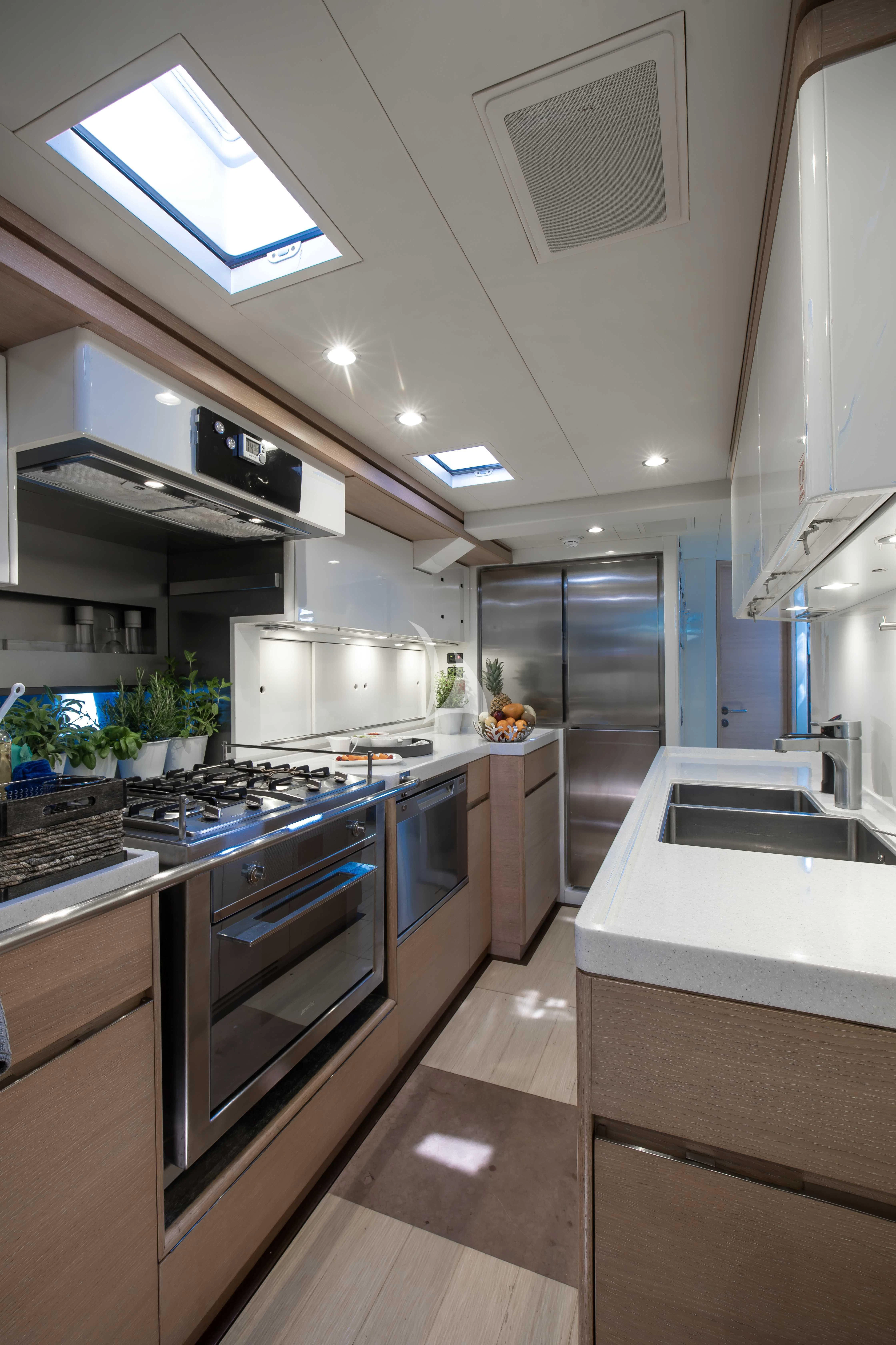 a kitchen with a large island aboard AMMONITE Yacht for Charter