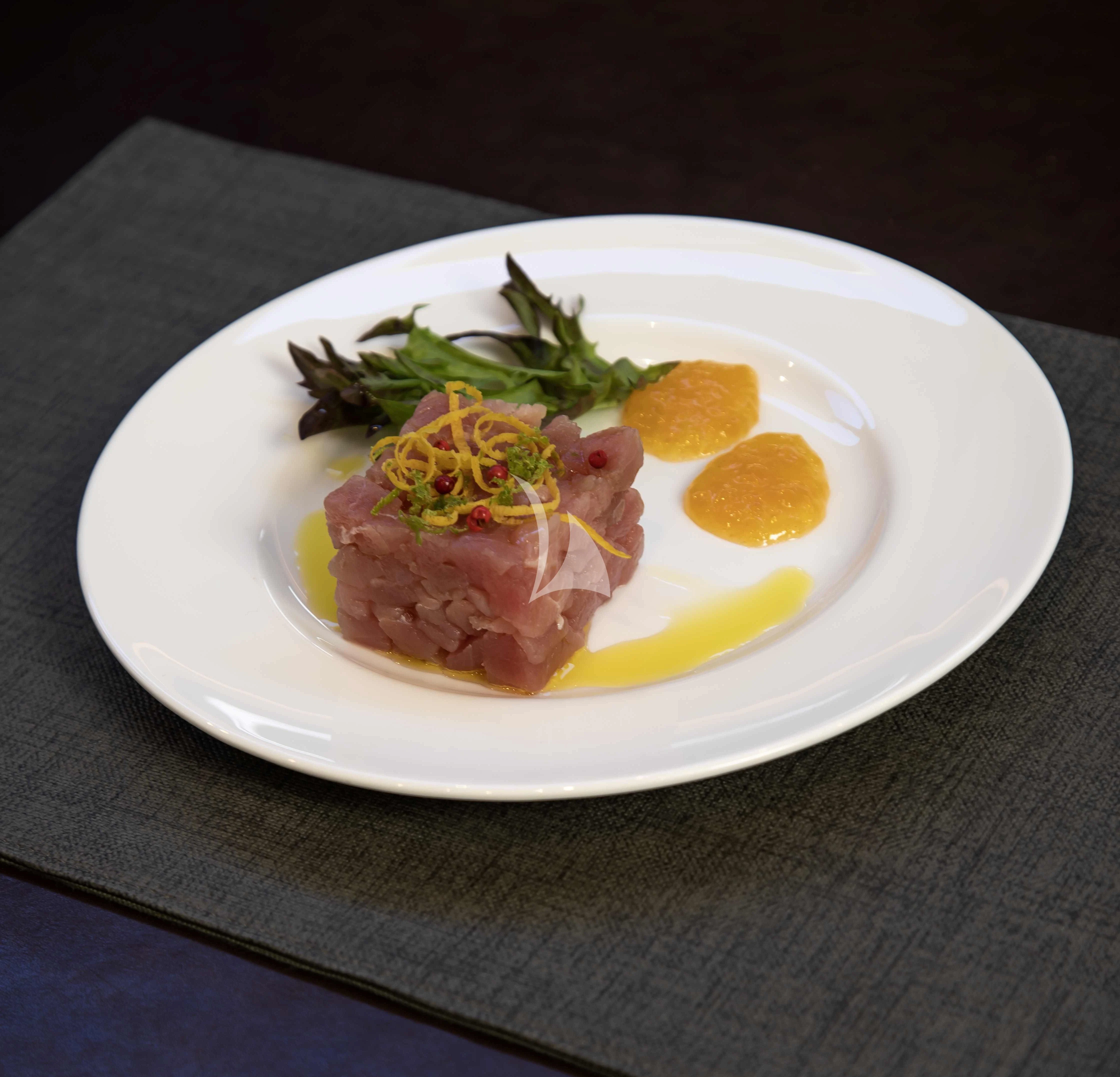 a plate of food aboard AMMONITE Yacht for Charter