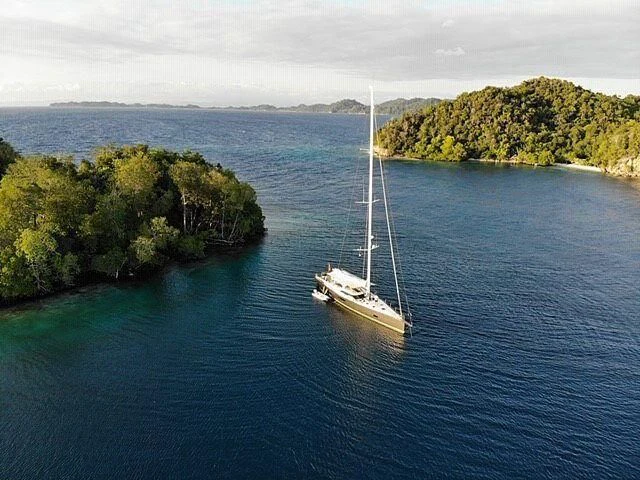 a boat sailing on the water aboard AMMONITE Yacht for Charter