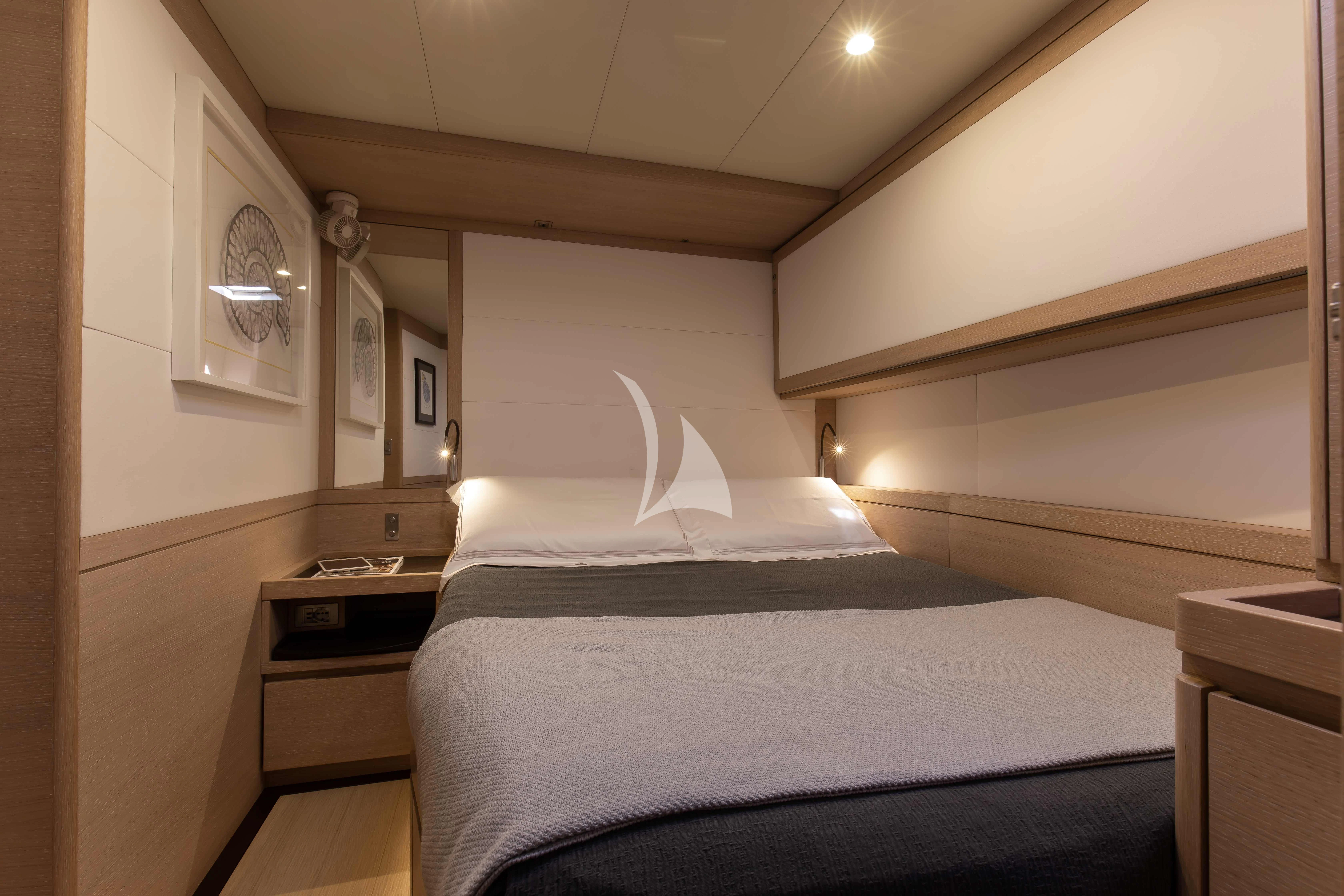 a bedroom with two beds aboard AMMONITE Yacht for Charter