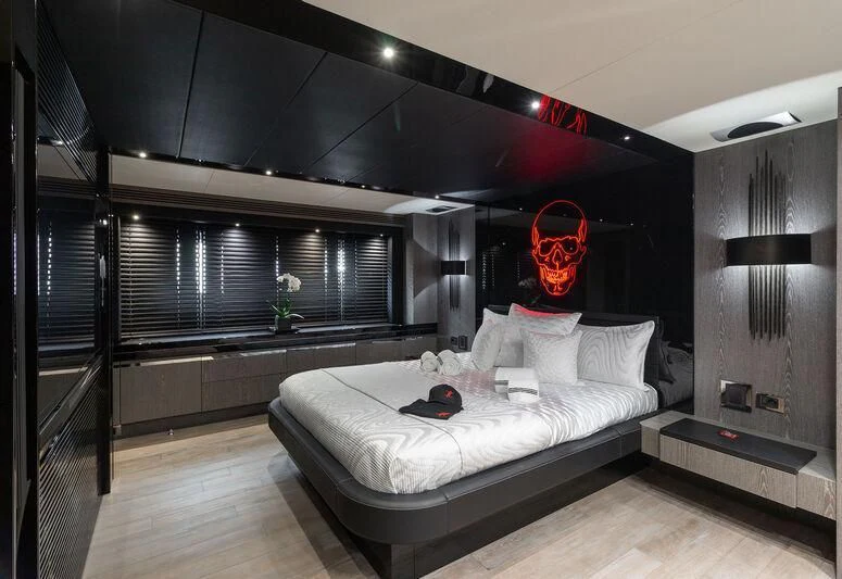 a room with a bed and a large window aboard MATZU Yacht for Sale