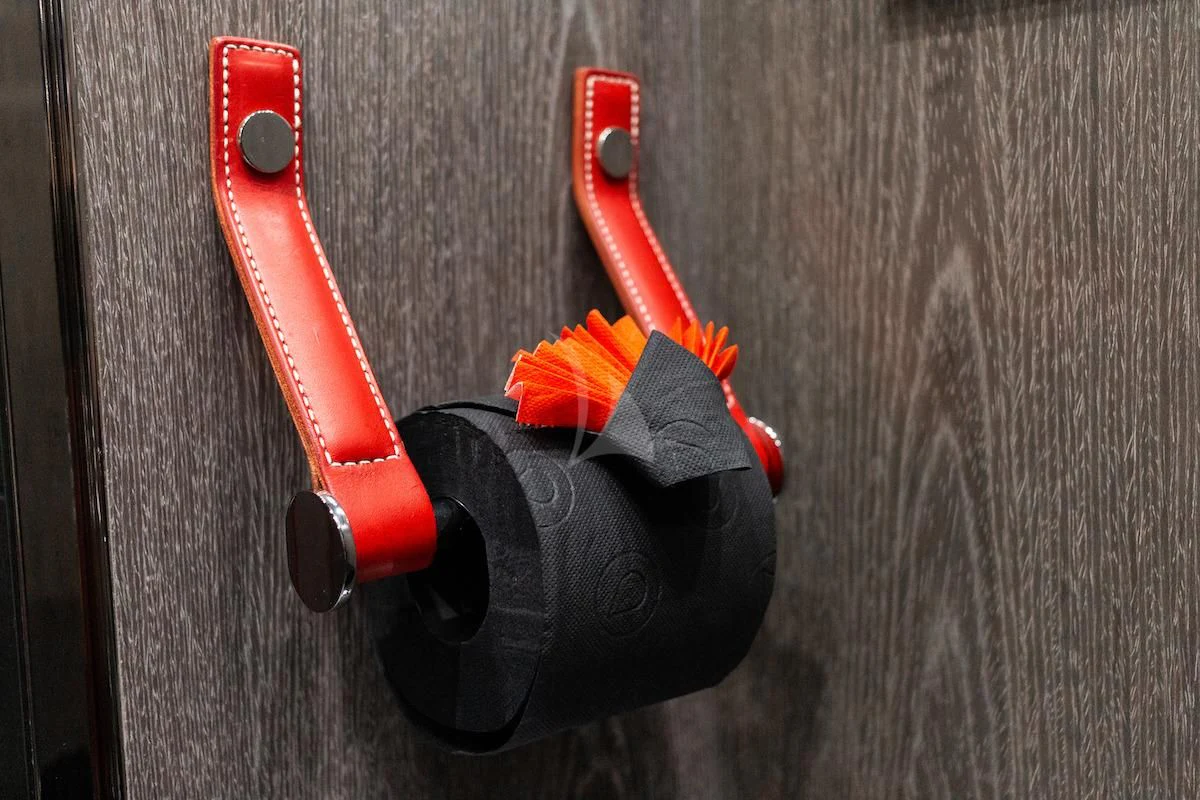 a black and red toy gun aboard MATZU Yacht for Sale