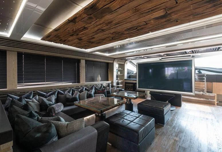 a living room with a large television aboard MATZU Yacht for Sale
