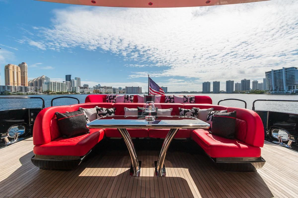 a couple of red boats on a dock with a city in the background aboard MATZU Yacht for Sale