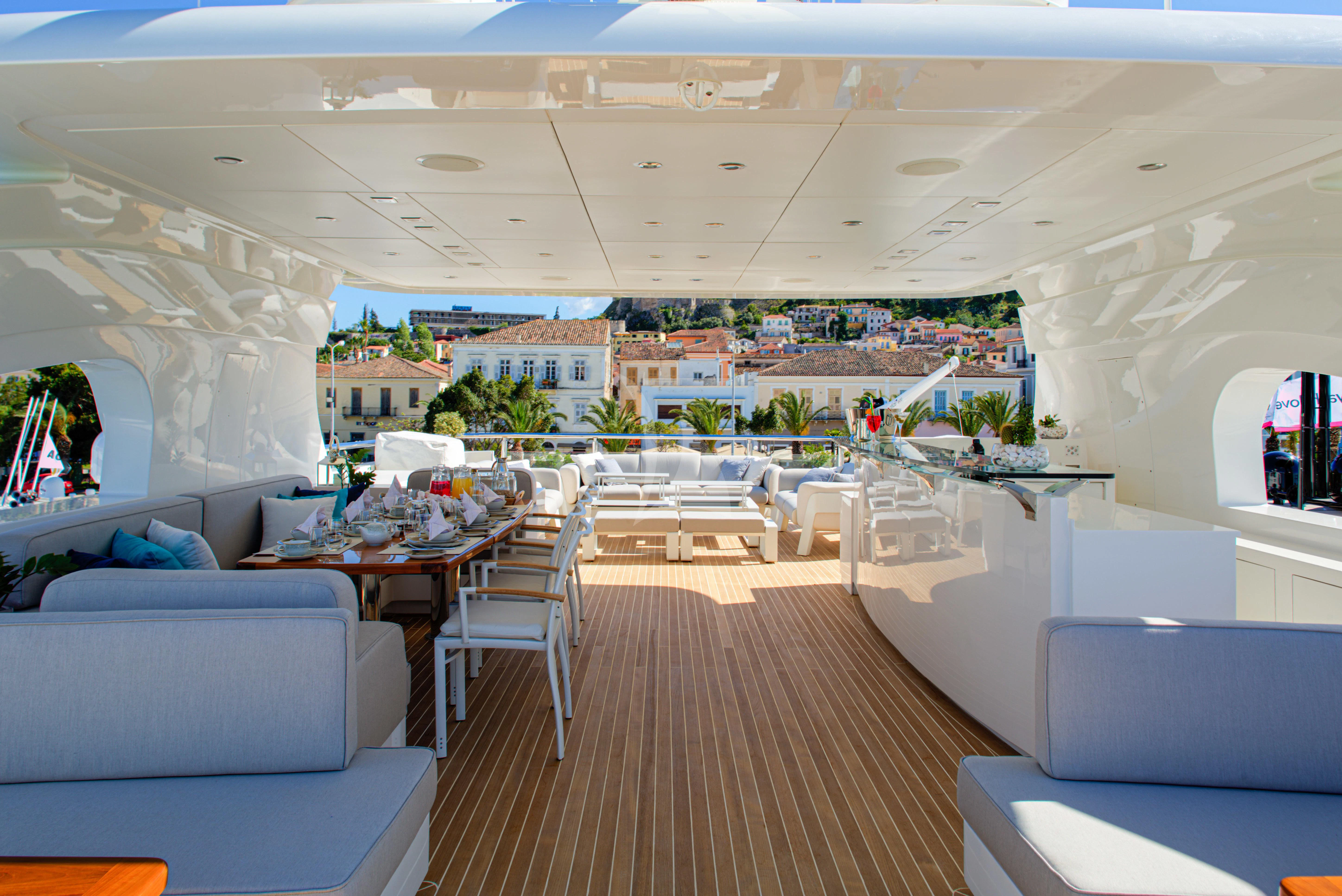 a large room with tables and chairs aboard I SEA Yacht for Charter