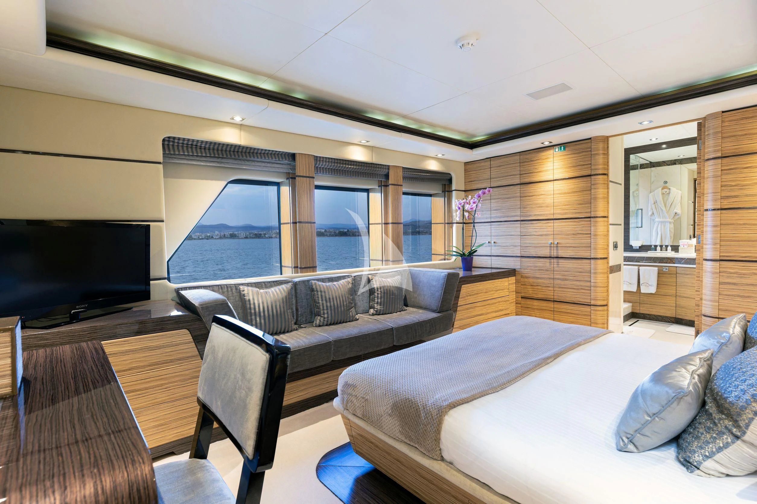 a room with a bed and a tv aboard I SEA Yacht for Charter