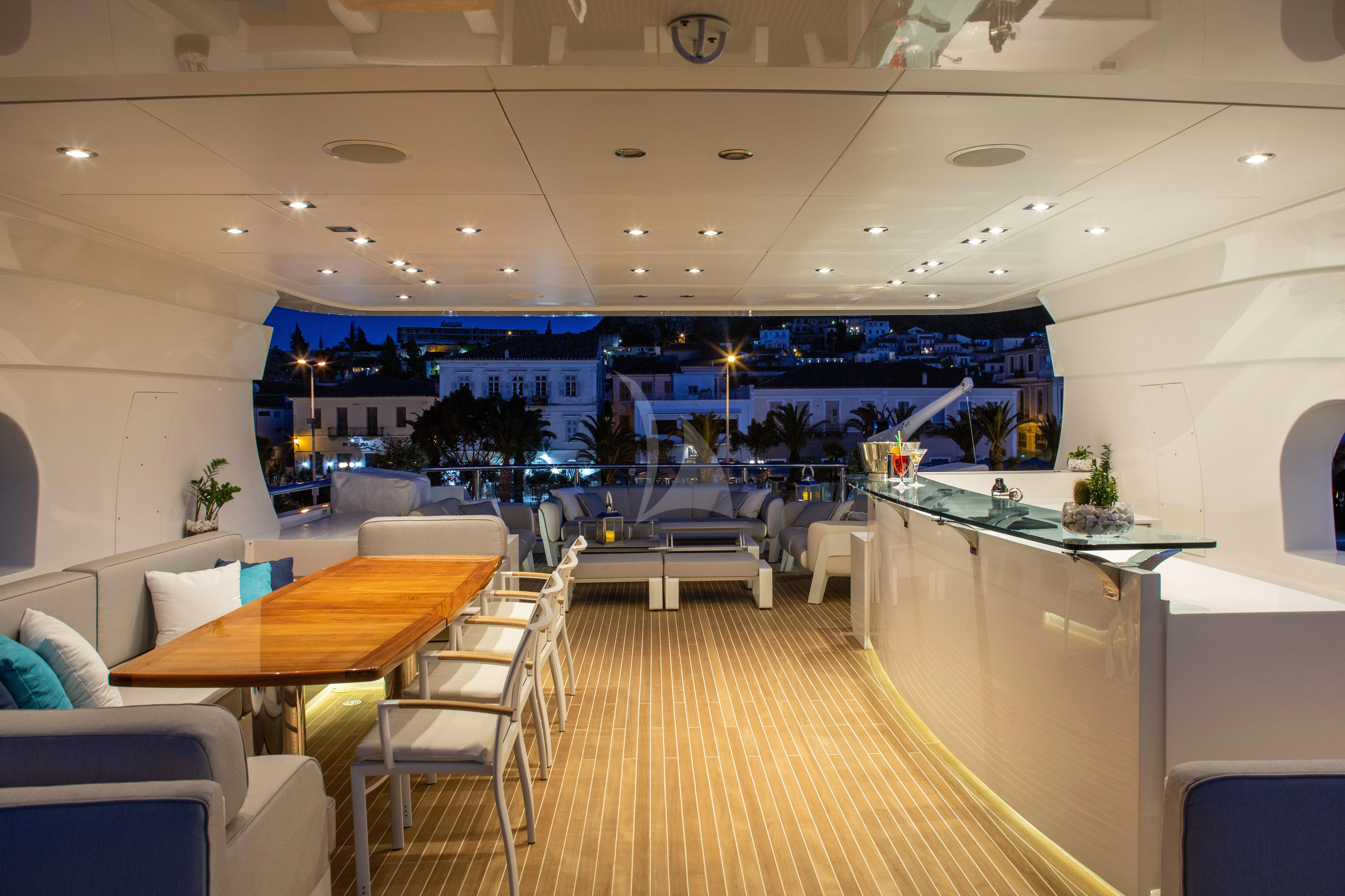 a room with tables and chairs aboard I SEA Yacht for Charter