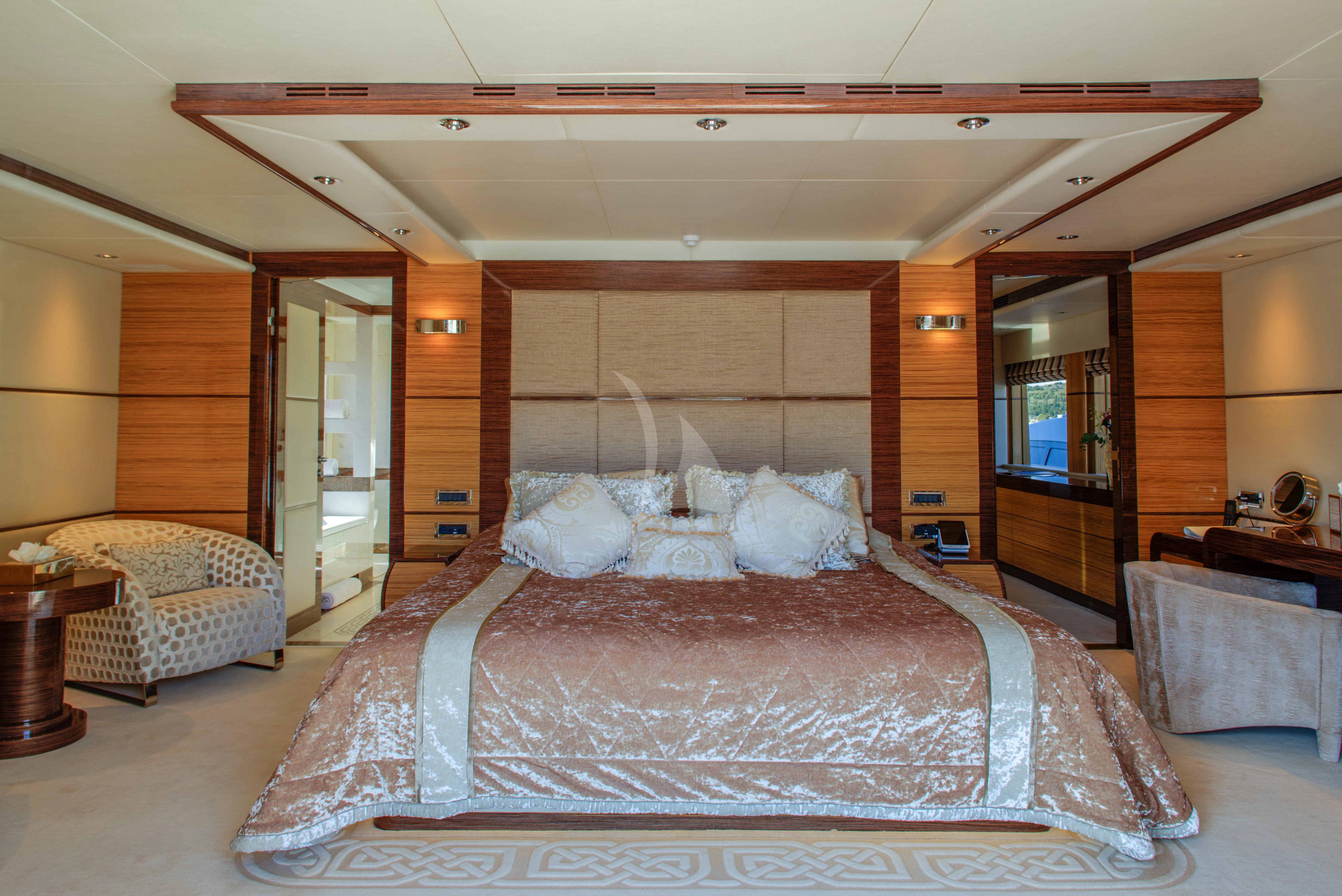 a large bed in a hotel room aboard I SEA Yacht for Charter