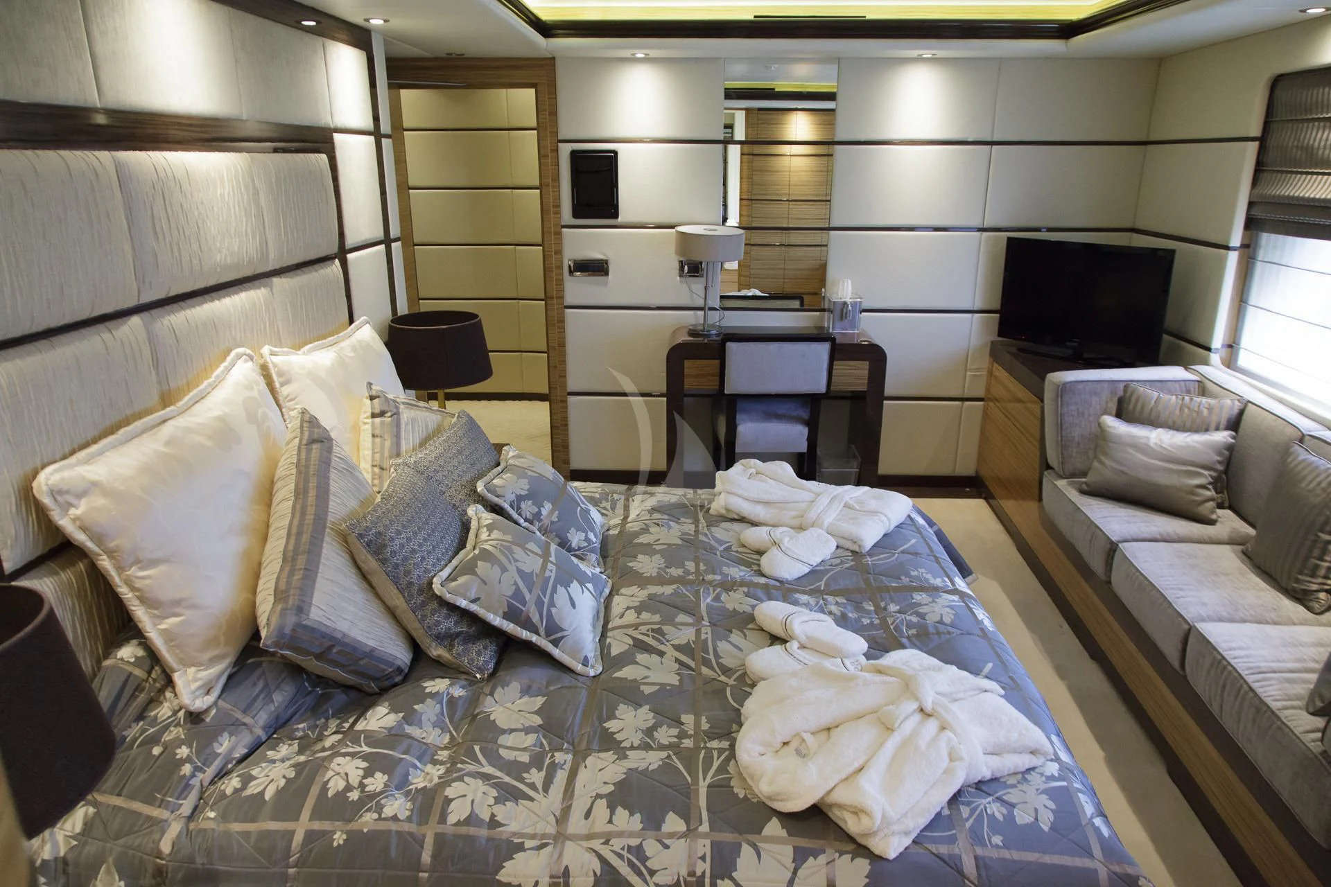 a room with a bed and a couch aboard I SEA Yacht for Charter