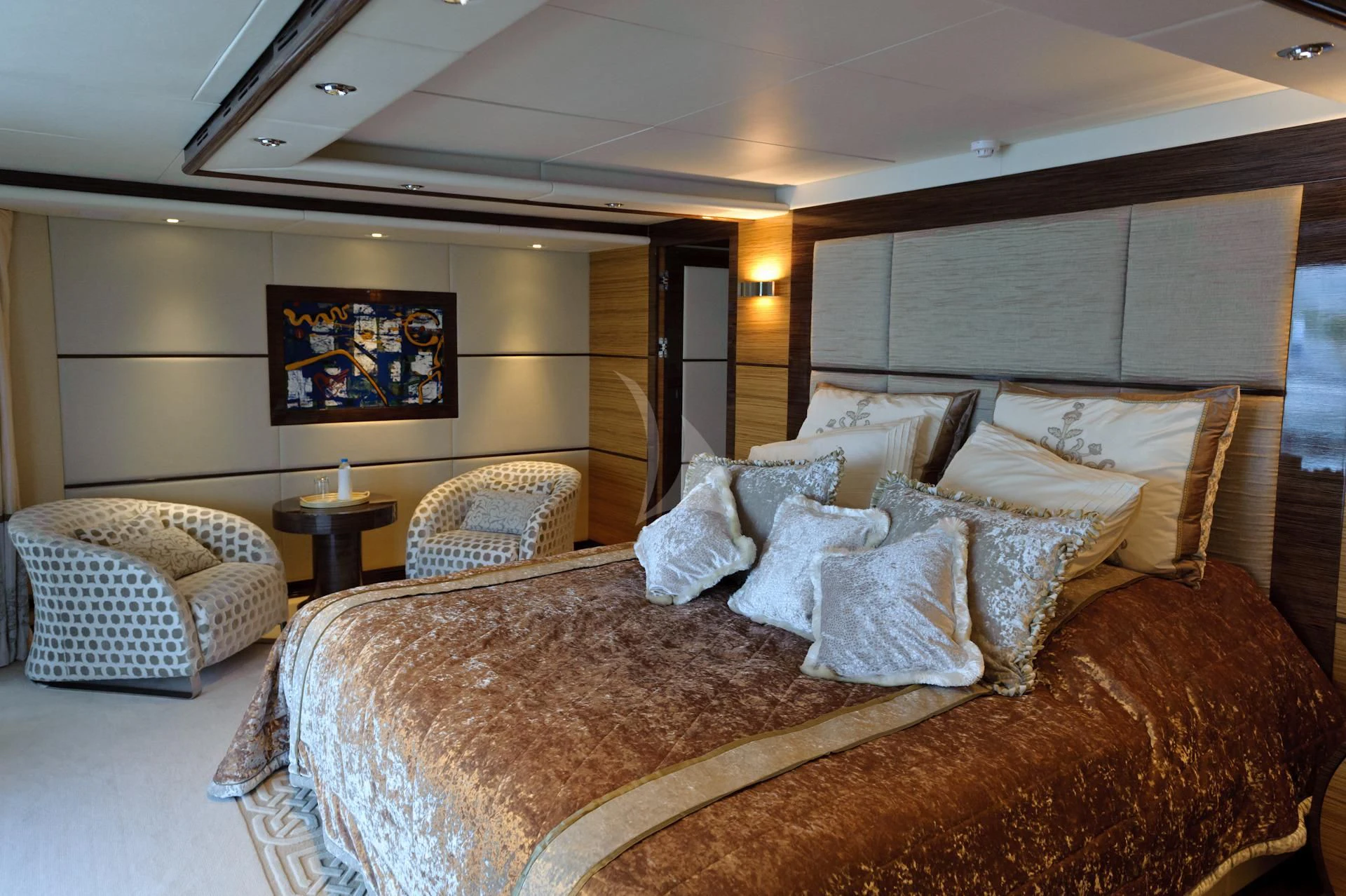 a large bed with a couple of pillows on it aboard I SEA Yacht for Charter