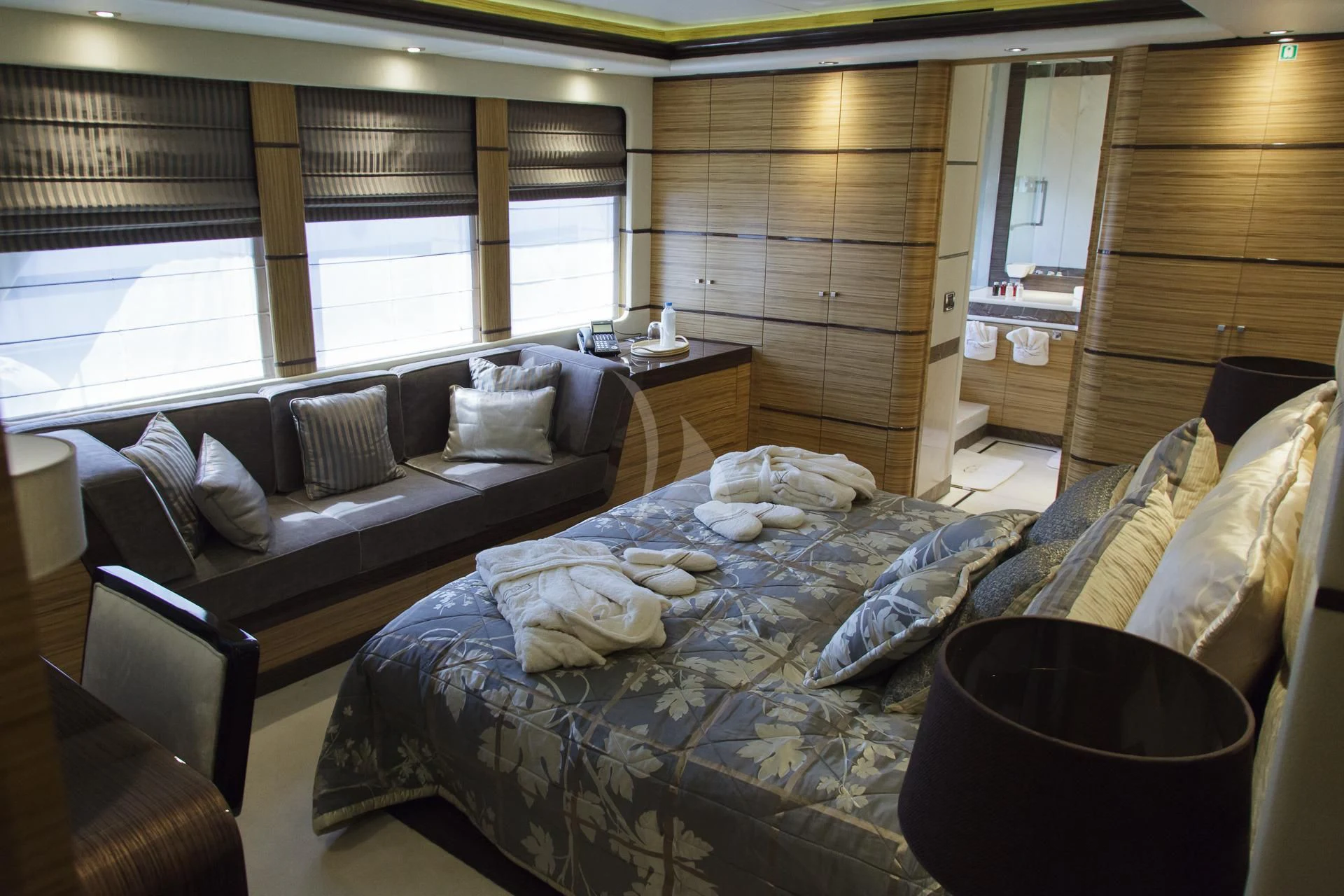 a room with a bed and a couch aboard I SEA Yacht for Charter