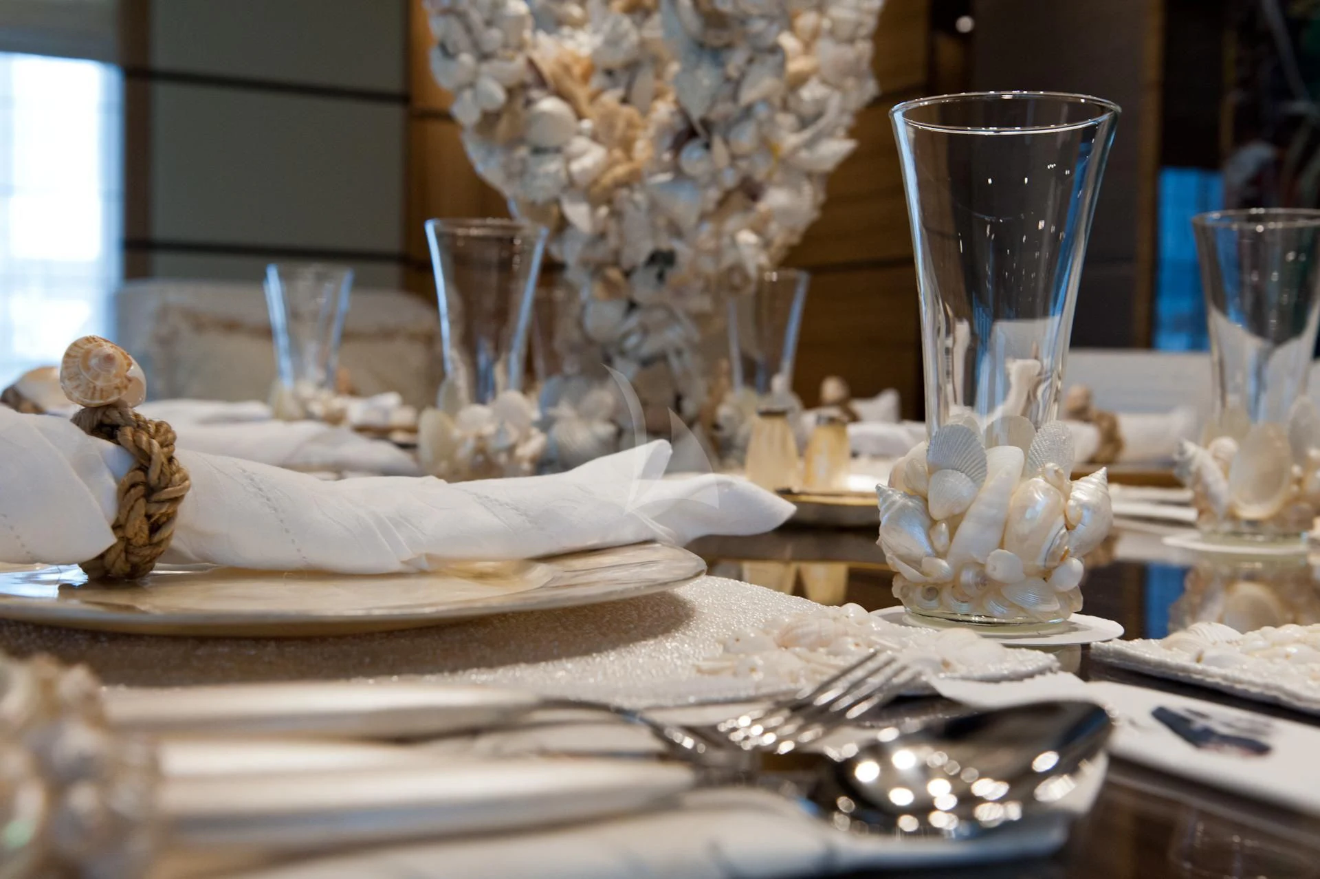 a table with plates and glasses aboard I SEA Yacht for Charter