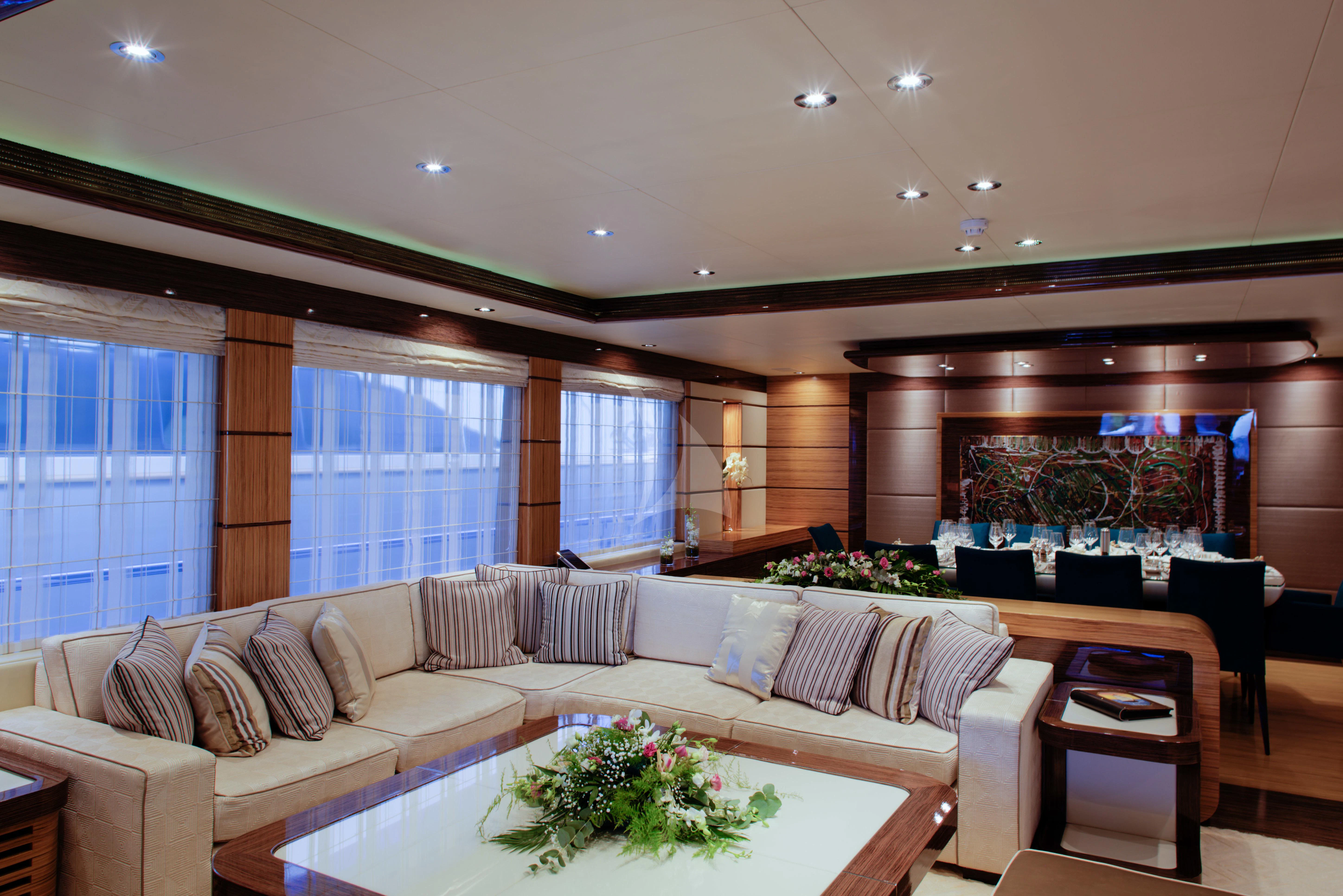 a living room with a large sofa aboard I SEA Yacht for Charter