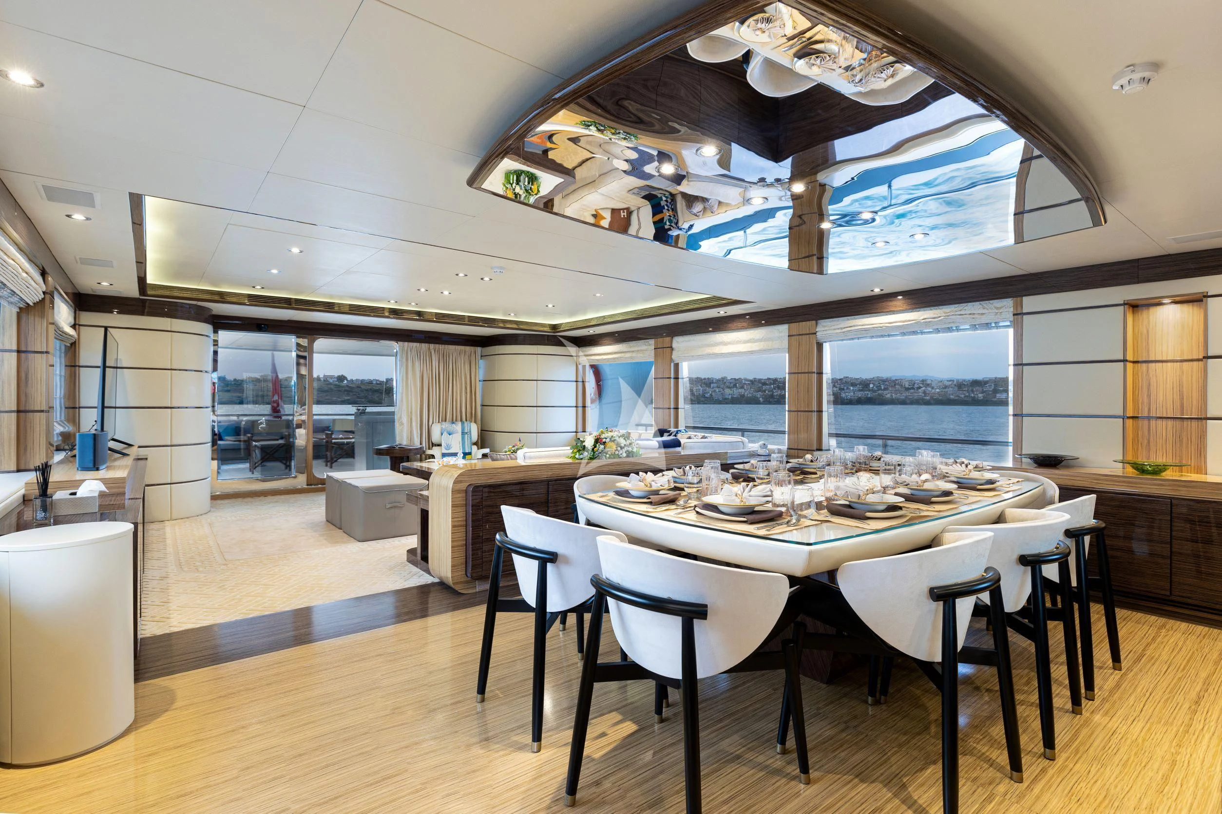 a large dining table in a room aboard I SEA Yacht for Charter