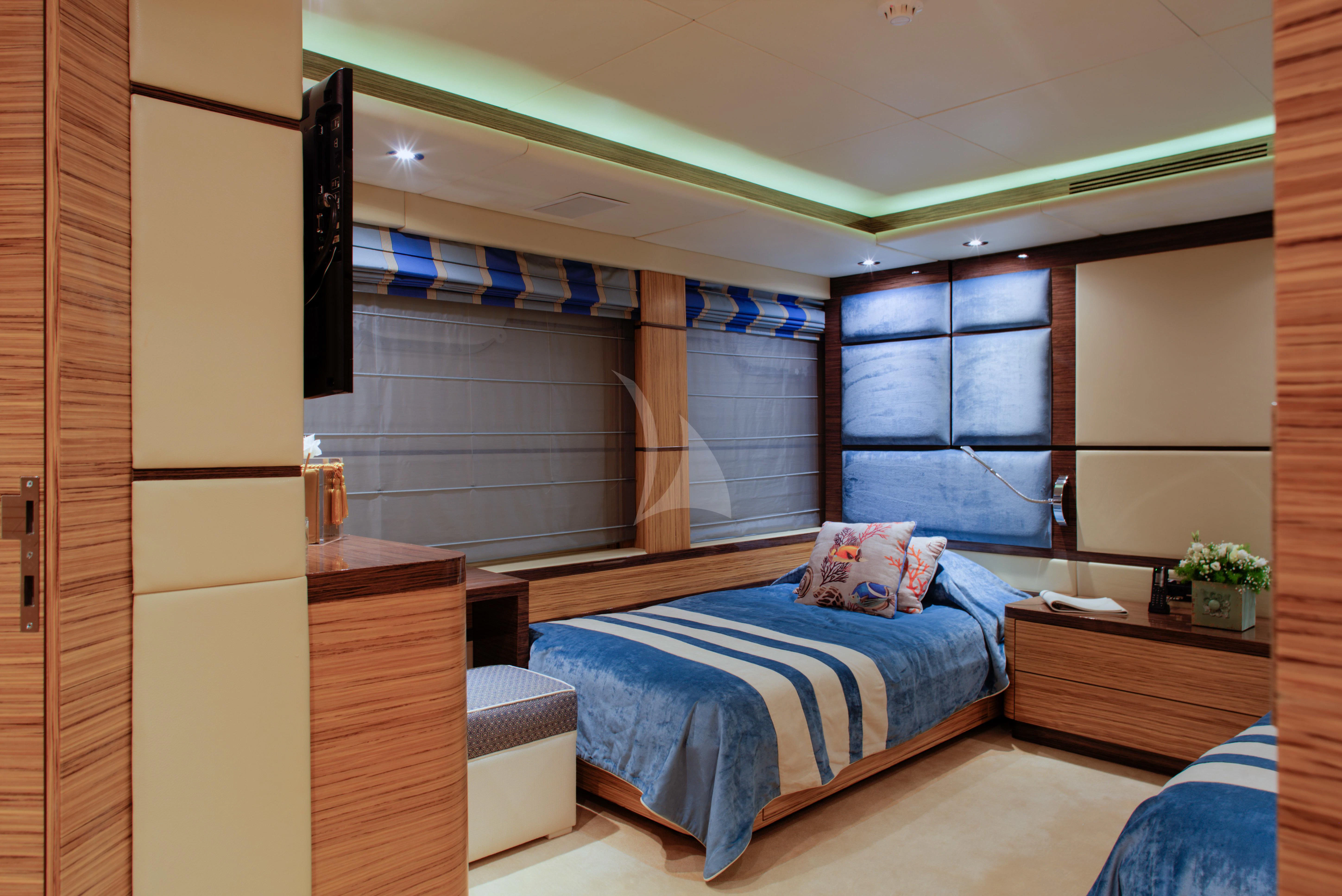 a bedroom with a bed and a window aboard I SEA Yacht for Charter