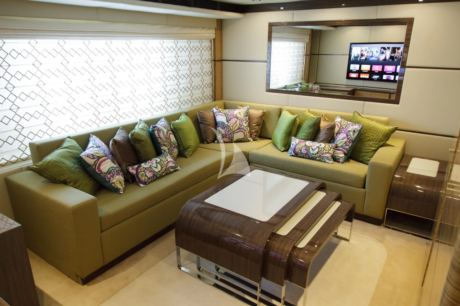 a living room with a couch and a tv aboard I SEA Yacht for Charter