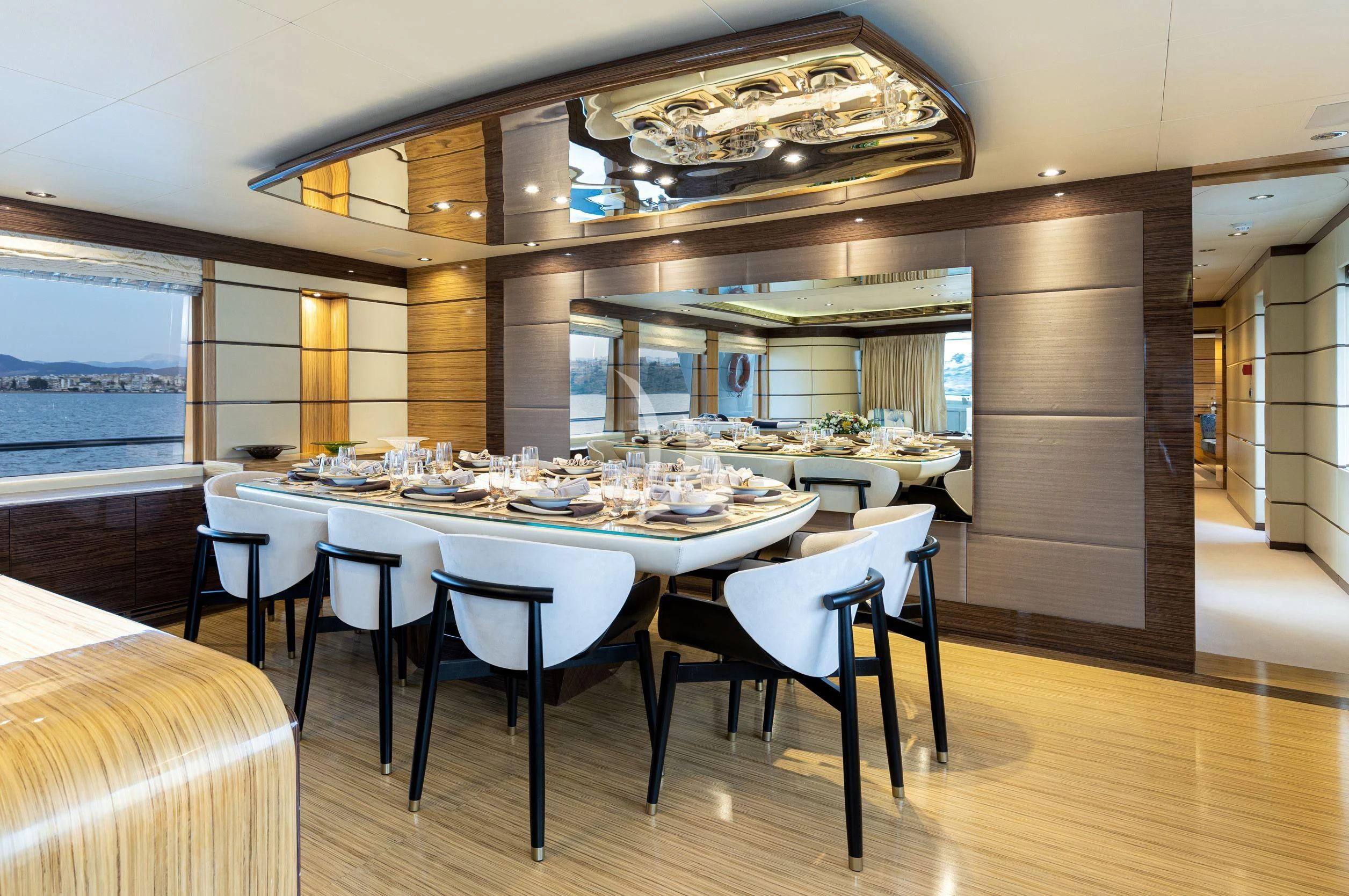 a large dining room with a table and chairs aboard I SEA Yacht for Charter