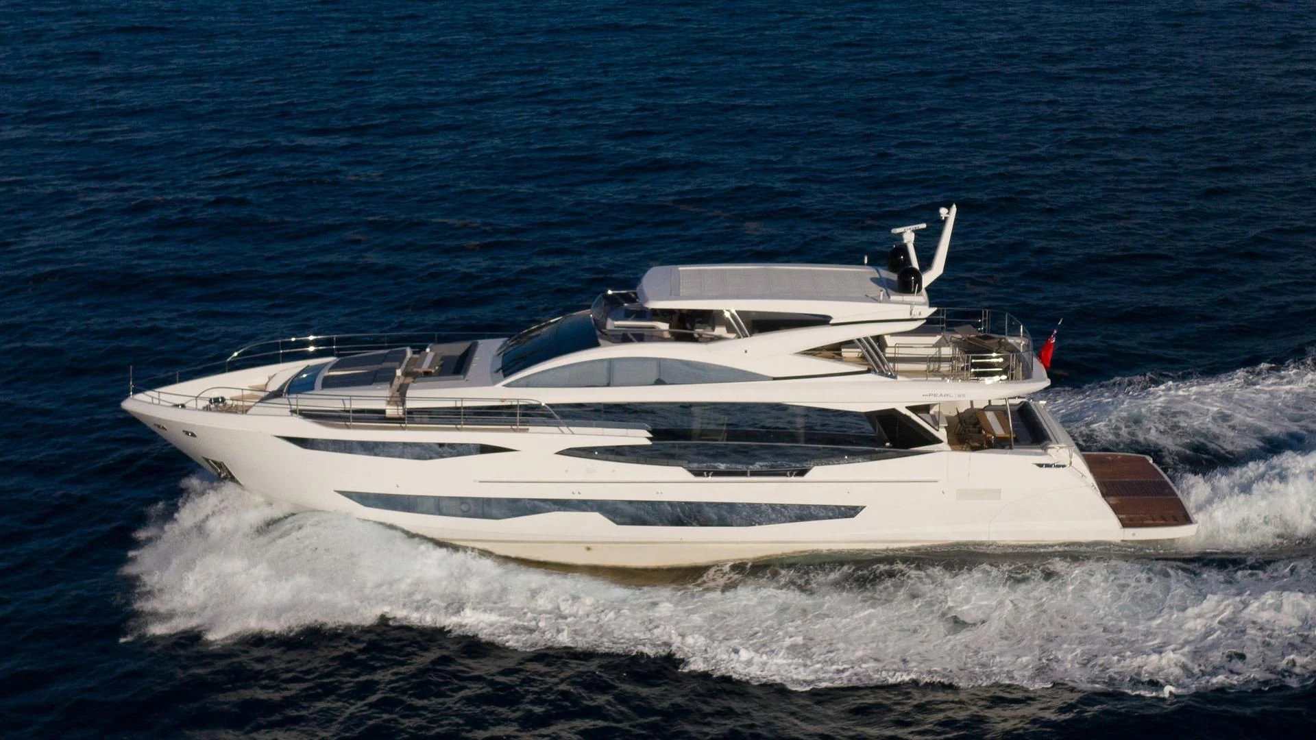 a white yacht on the water aboard PEARL Yacht for Sale