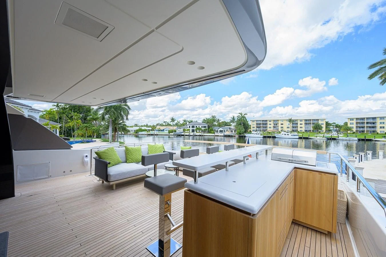 a room with a pool and a deck with a view of the city aboard PEARL Yacht for Sale