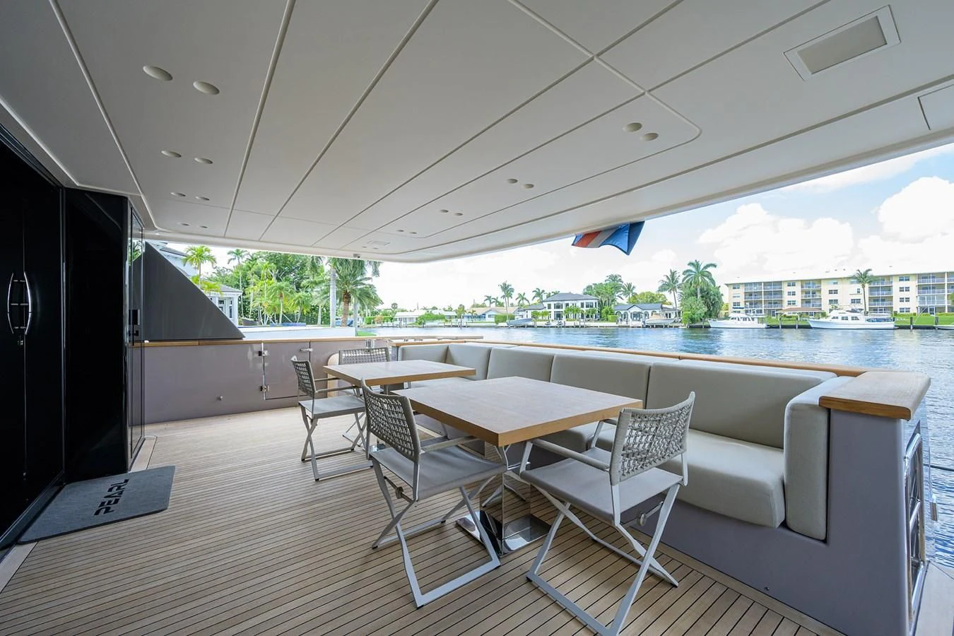 a room with a table and chairs aboard PEARL Yacht for Sale