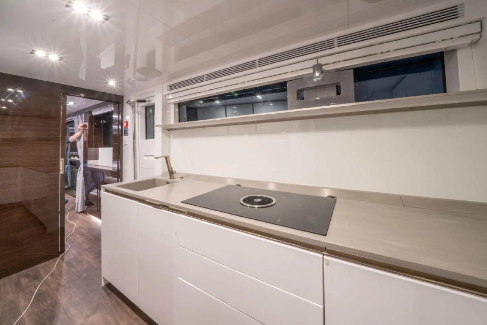 a kitchen with a stove and a sink aboard PEARL Yacht for Sale