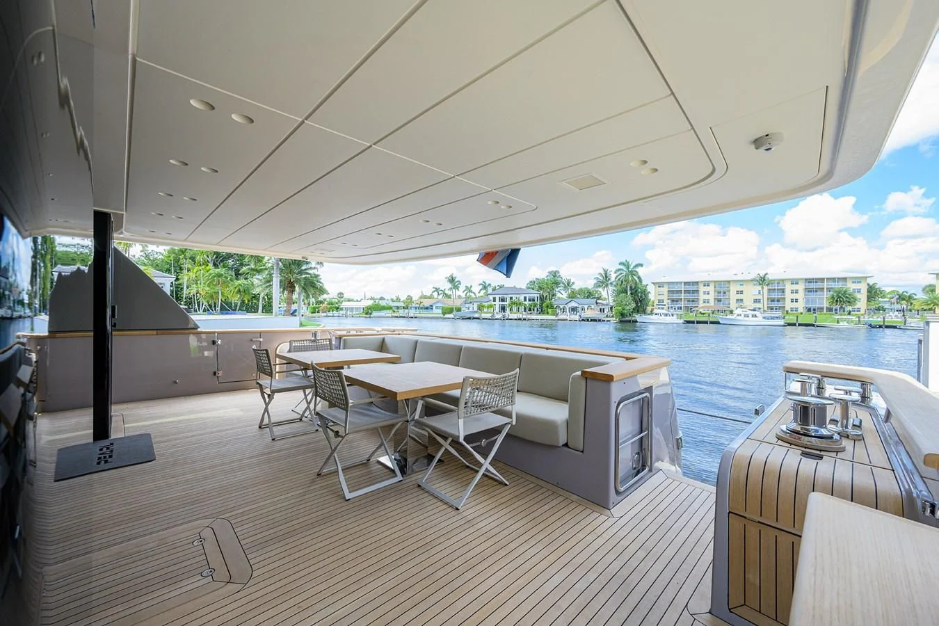 a room with a table chairs and a pool aboard PEARL Yacht for Sale