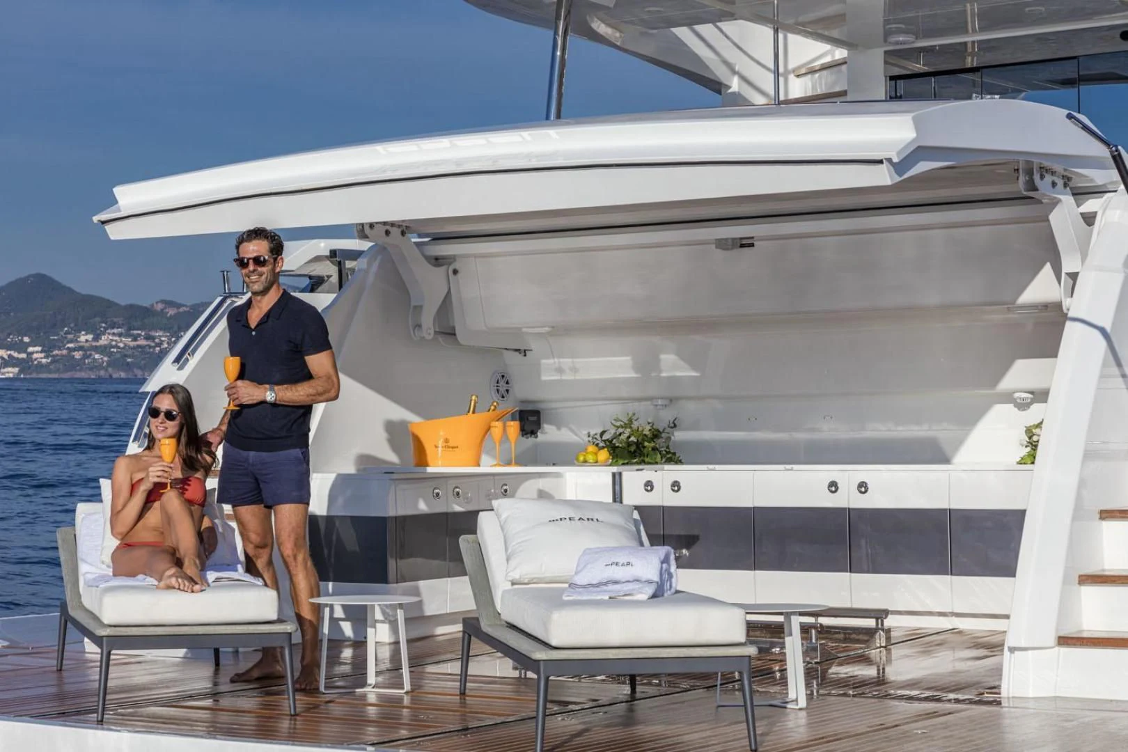 a man and a woman standing on a boat aboard PEARL Yacht for Sale