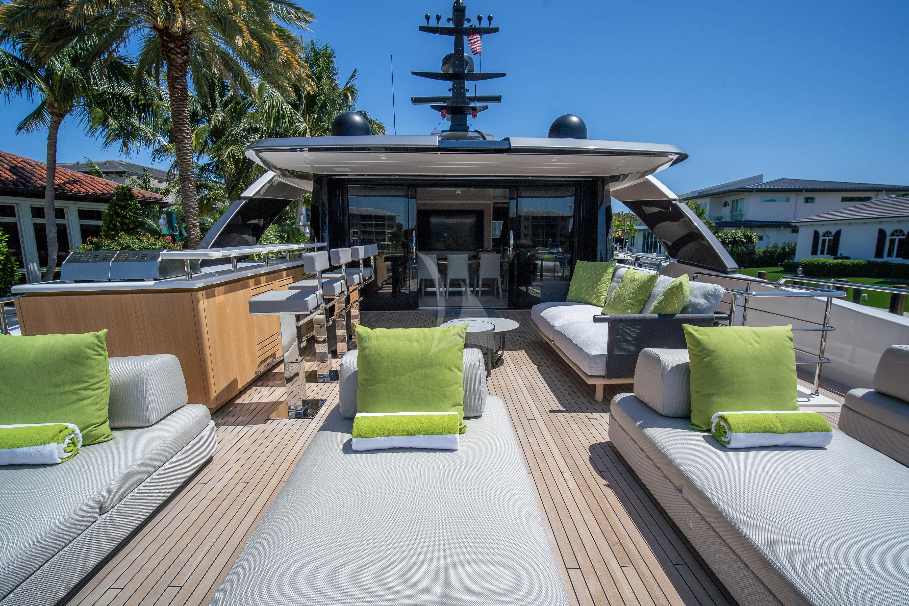 a large patio with couches and chairs aboard PEARL Yacht for Sale