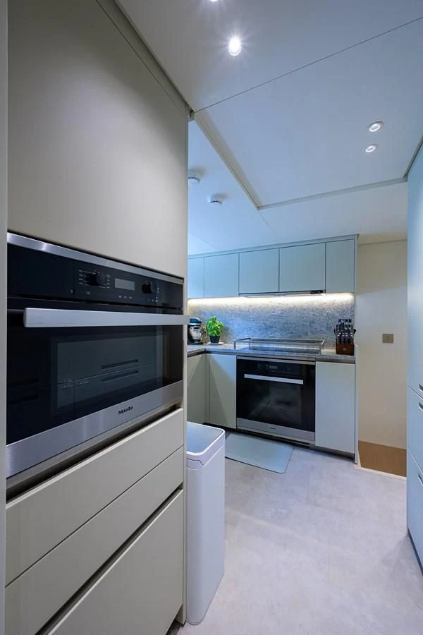 a kitchen with a stove and oven aboard PEARL Yacht for Sale