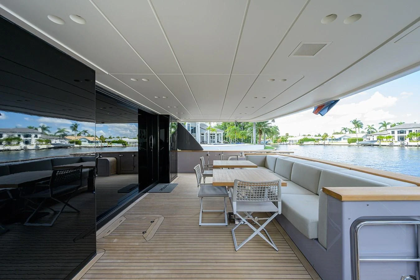 a room with a table chairs and a large window aboard PEARL Yacht for Sale