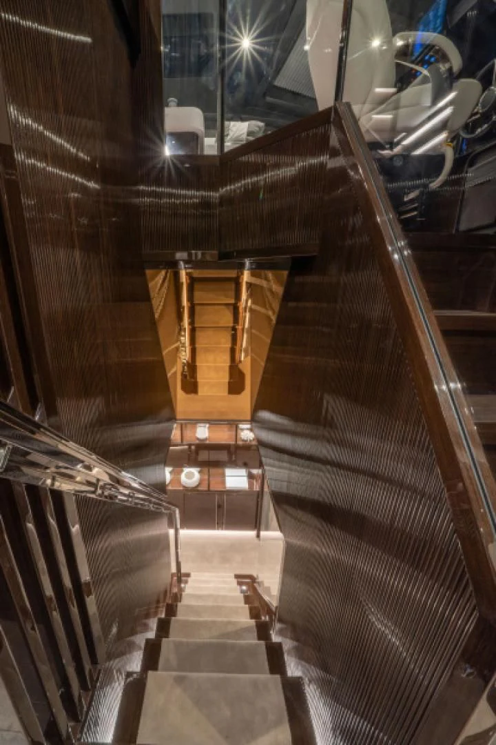 a staircase with a metal railing aboard PEARL Yacht for Sale