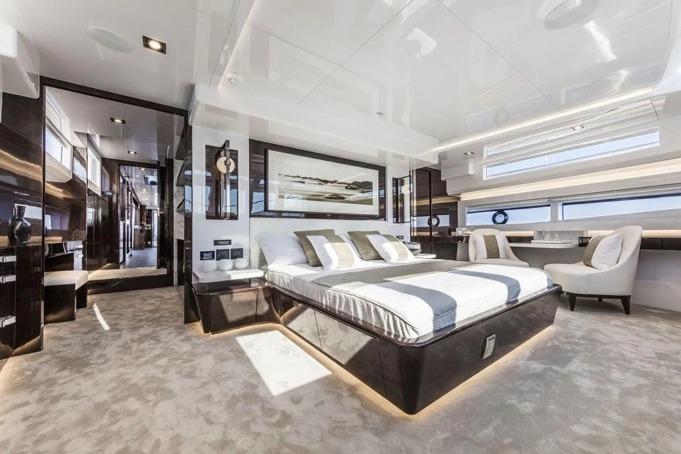 a large bedroom with a large bed aboard PEARL Yacht for Sale