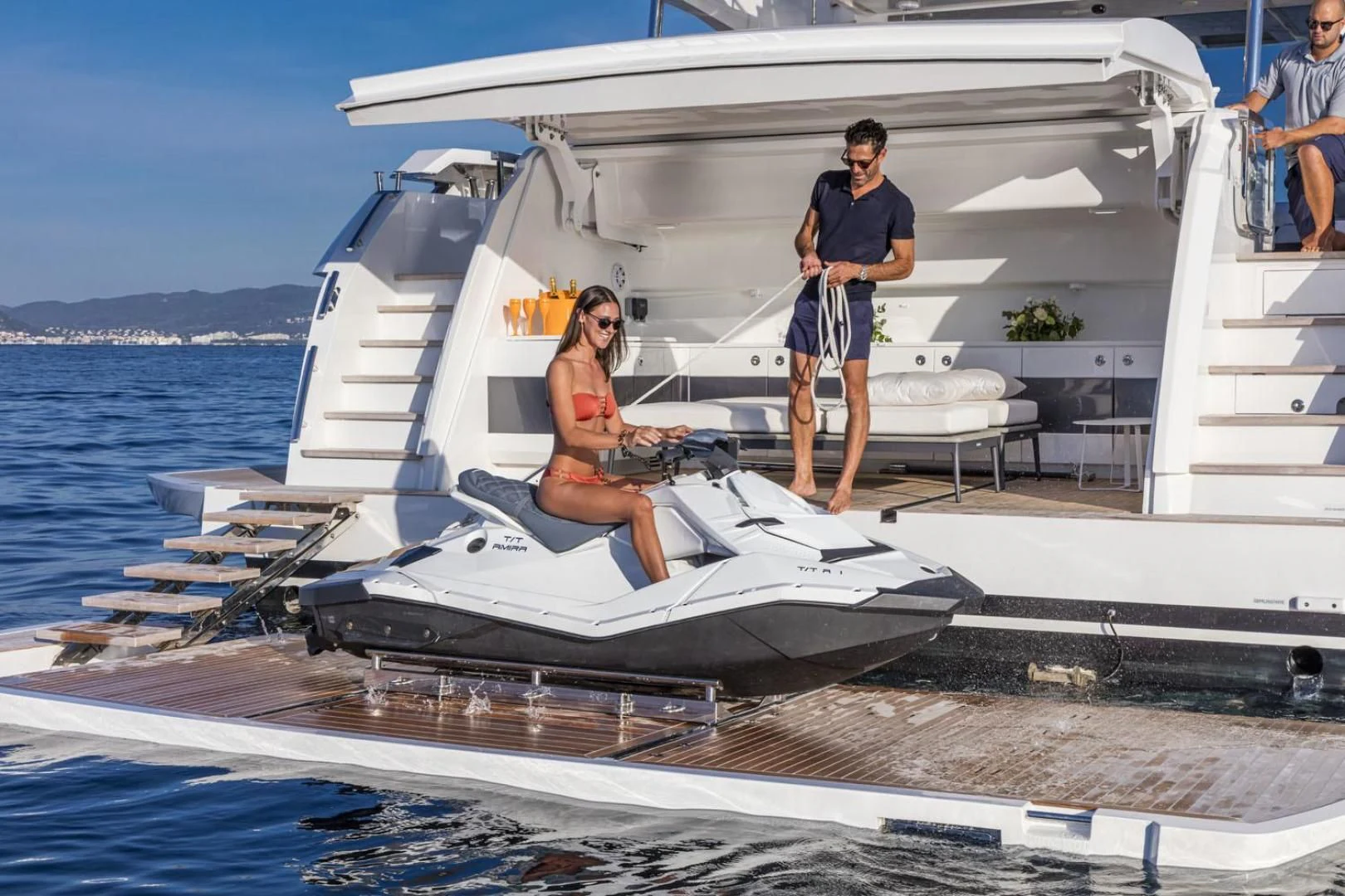 a man and woman standing on a boat aboard PEARL Yacht for Sale