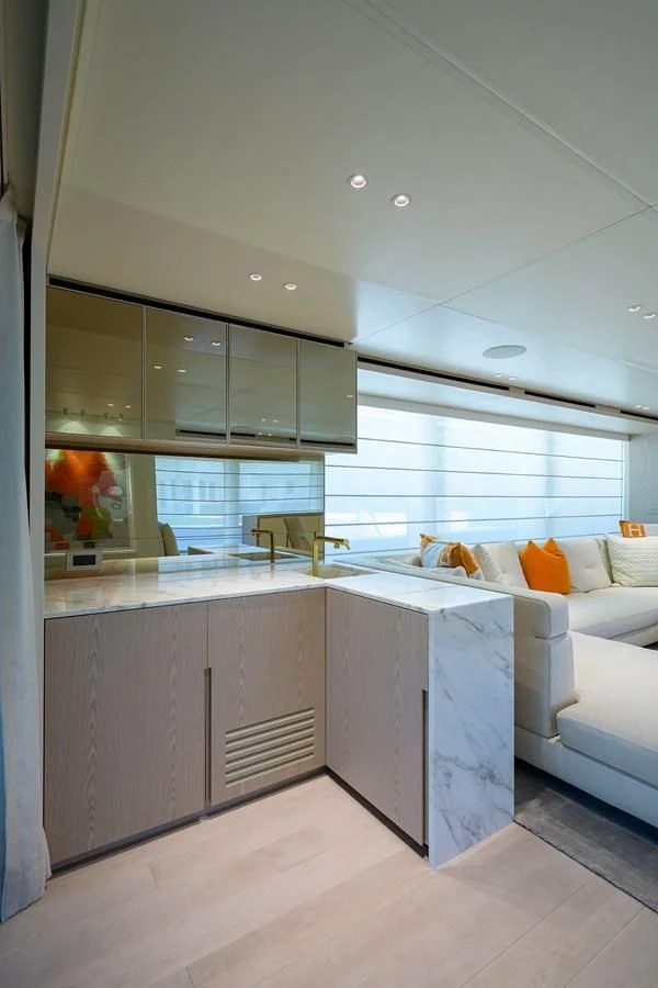 a kitchen with a large window aboard PEARL Yacht for Sale