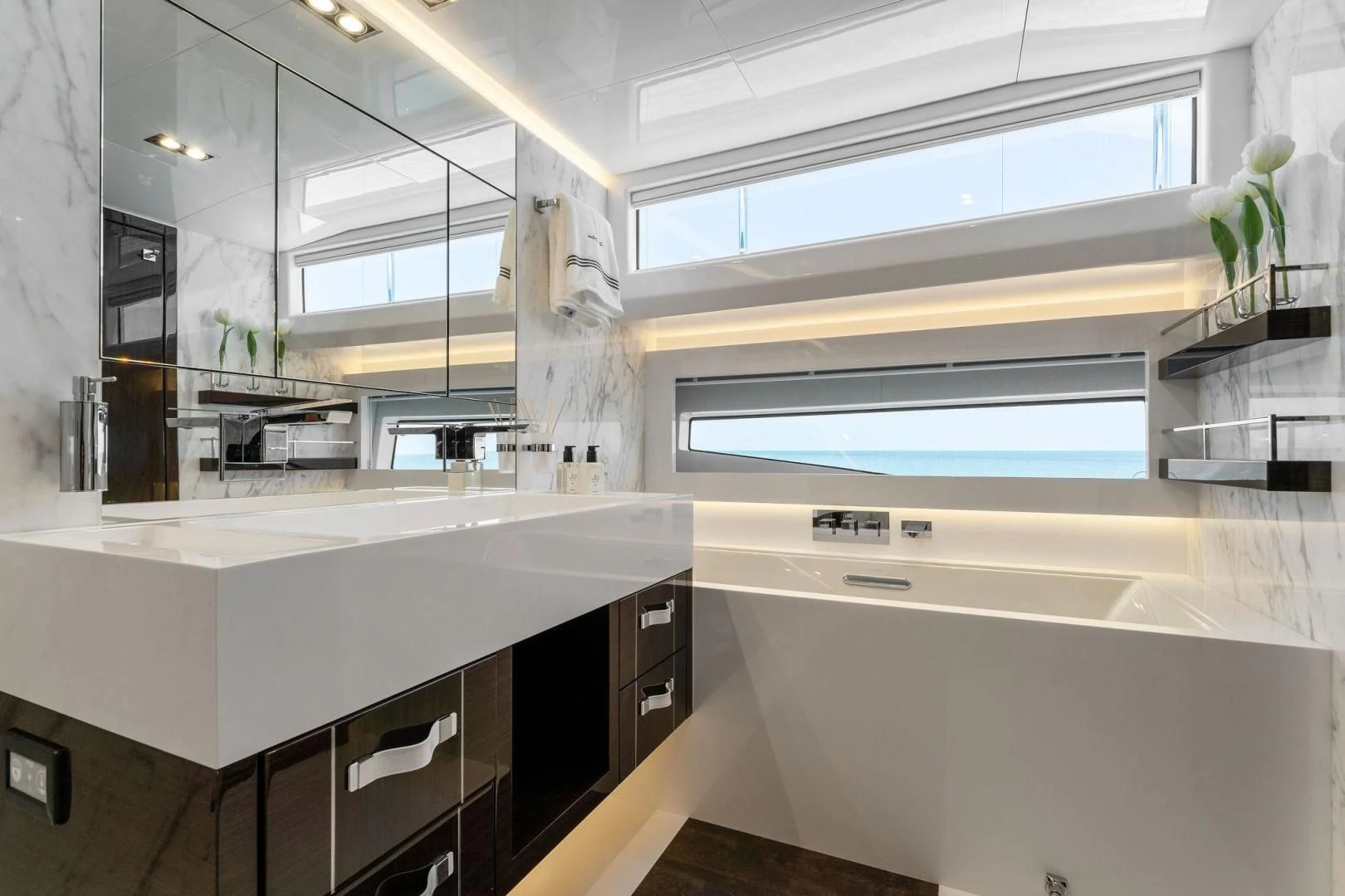 a kitchen with white cabinets aboard PEARL Yacht for Sale