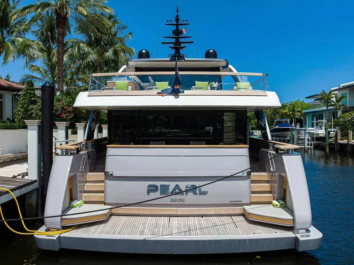a boat docked at a pier aboard PEARL Yacht for Sale