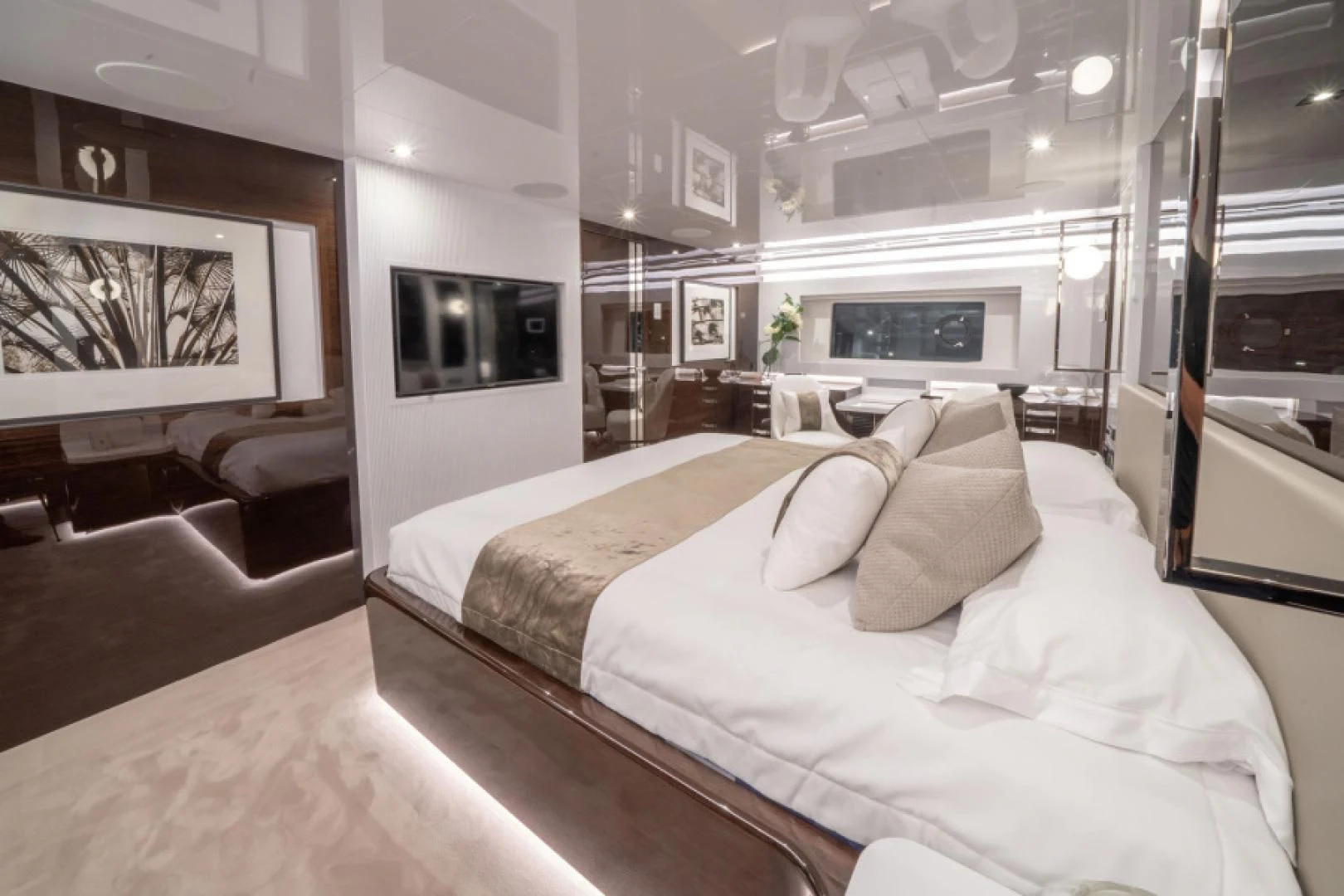 a large bedroom with a bed aboard PEARL Yacht for Sale