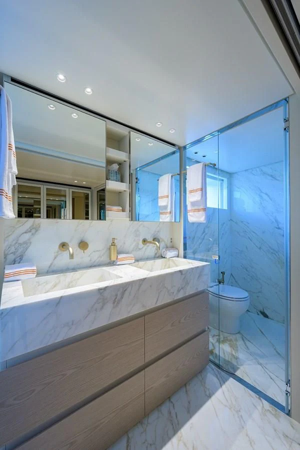 a bathroom with a large mirror aboard PEARL Yacht for Sale