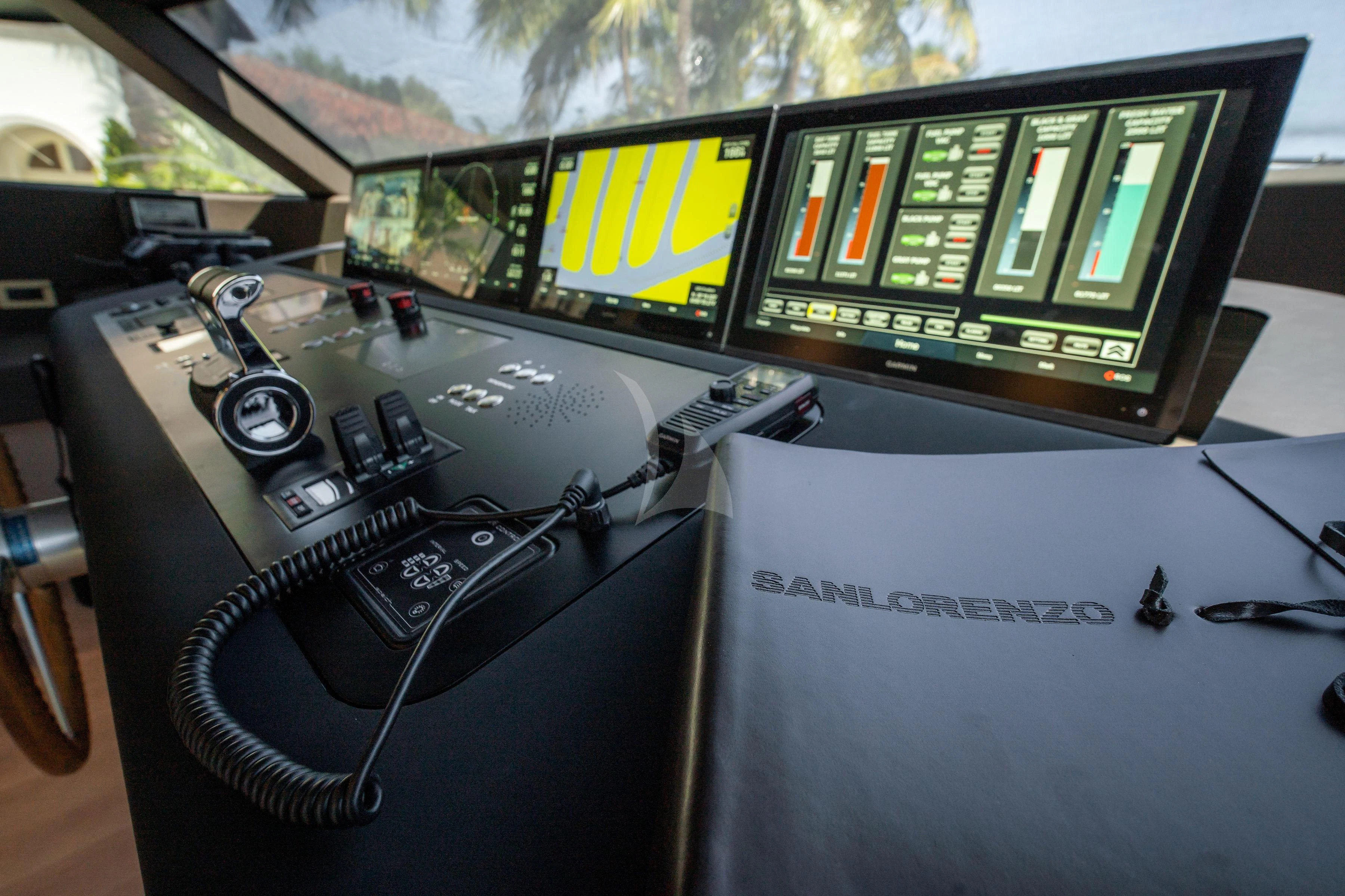 a console with a screen and a game console aboard PEARL Yacht for Sale