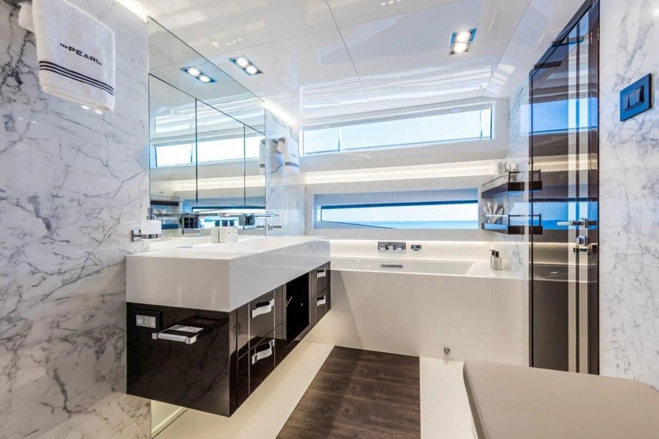 a kitchen with a countertop sink and cabinets aboard PEARL Yacht for Sale