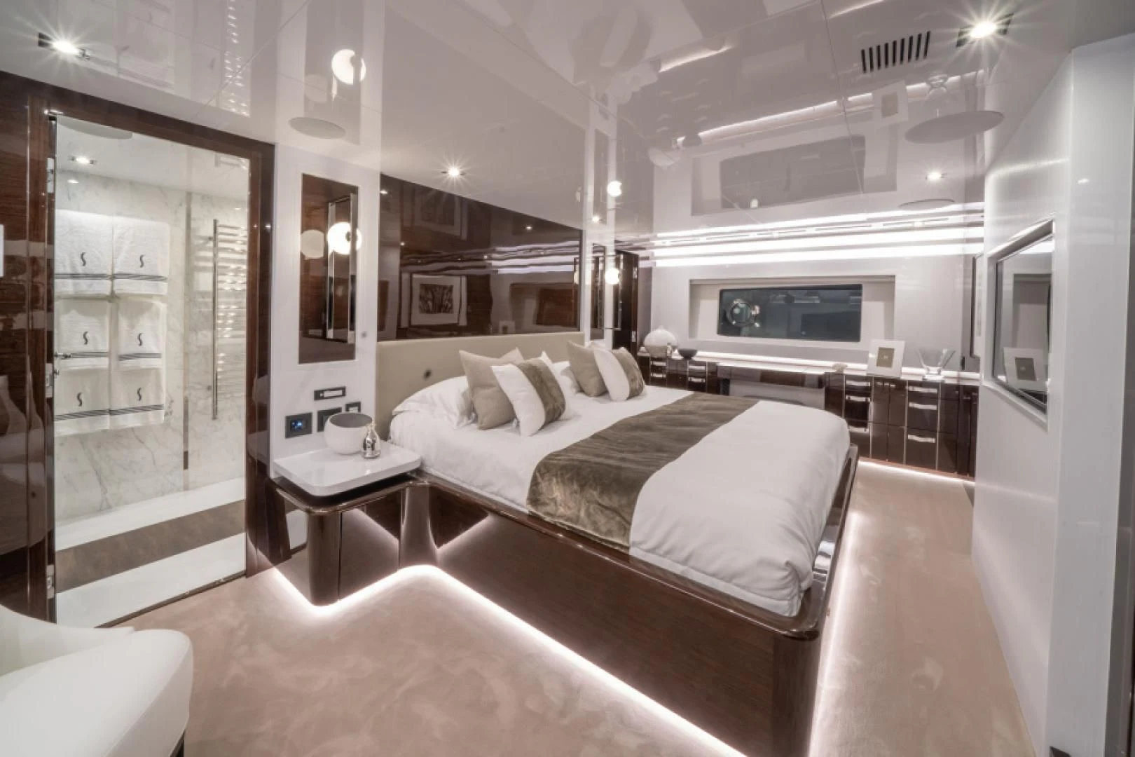 a large bedroom with a bed aboard PEARL Yacht for Sale