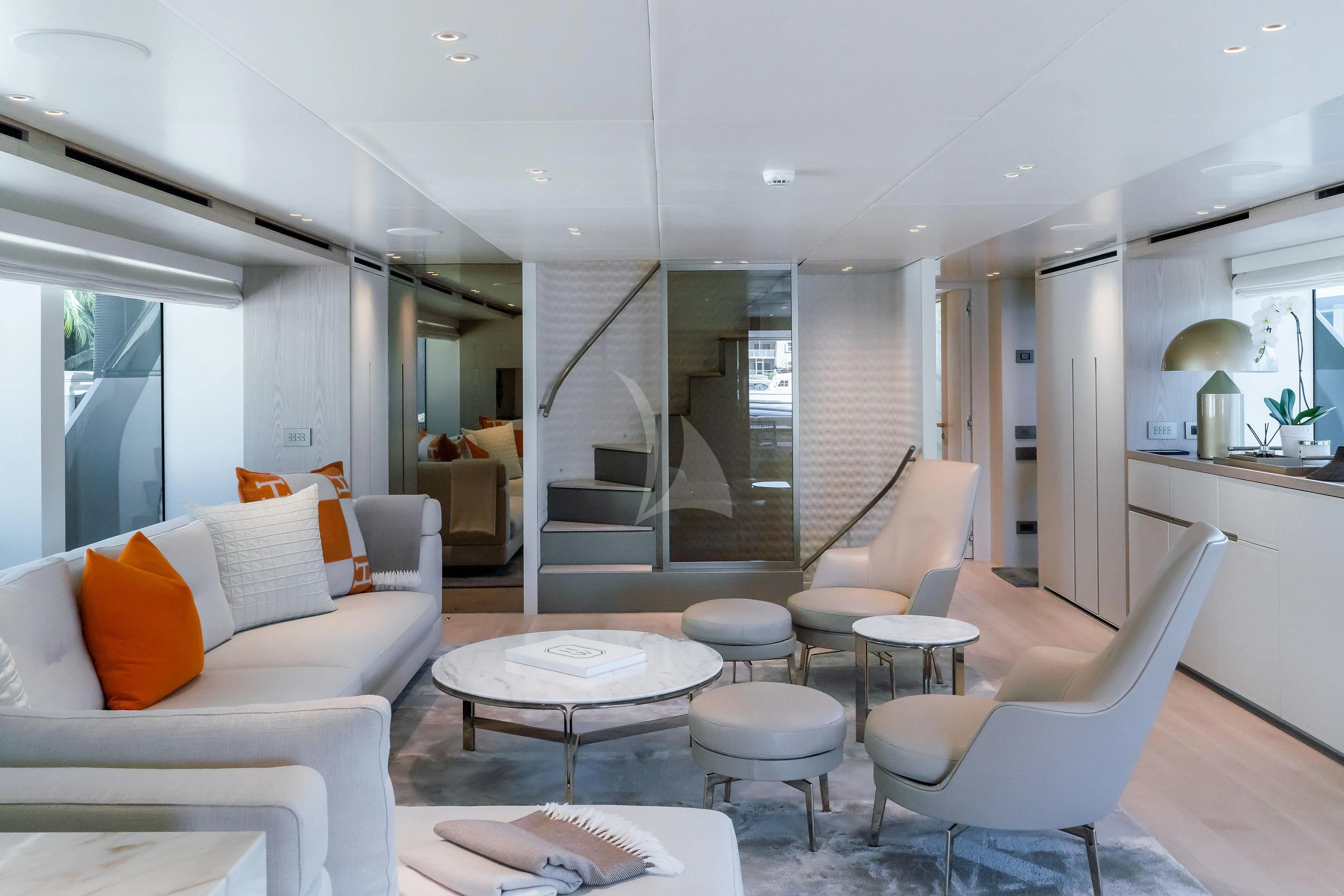 a living room with a staircase aboard PEARL Yacht for Sale