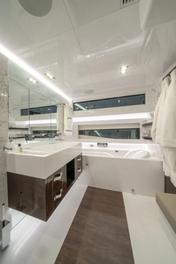 a bathroom with a large mirror aboard PEARL Yacht for Sale