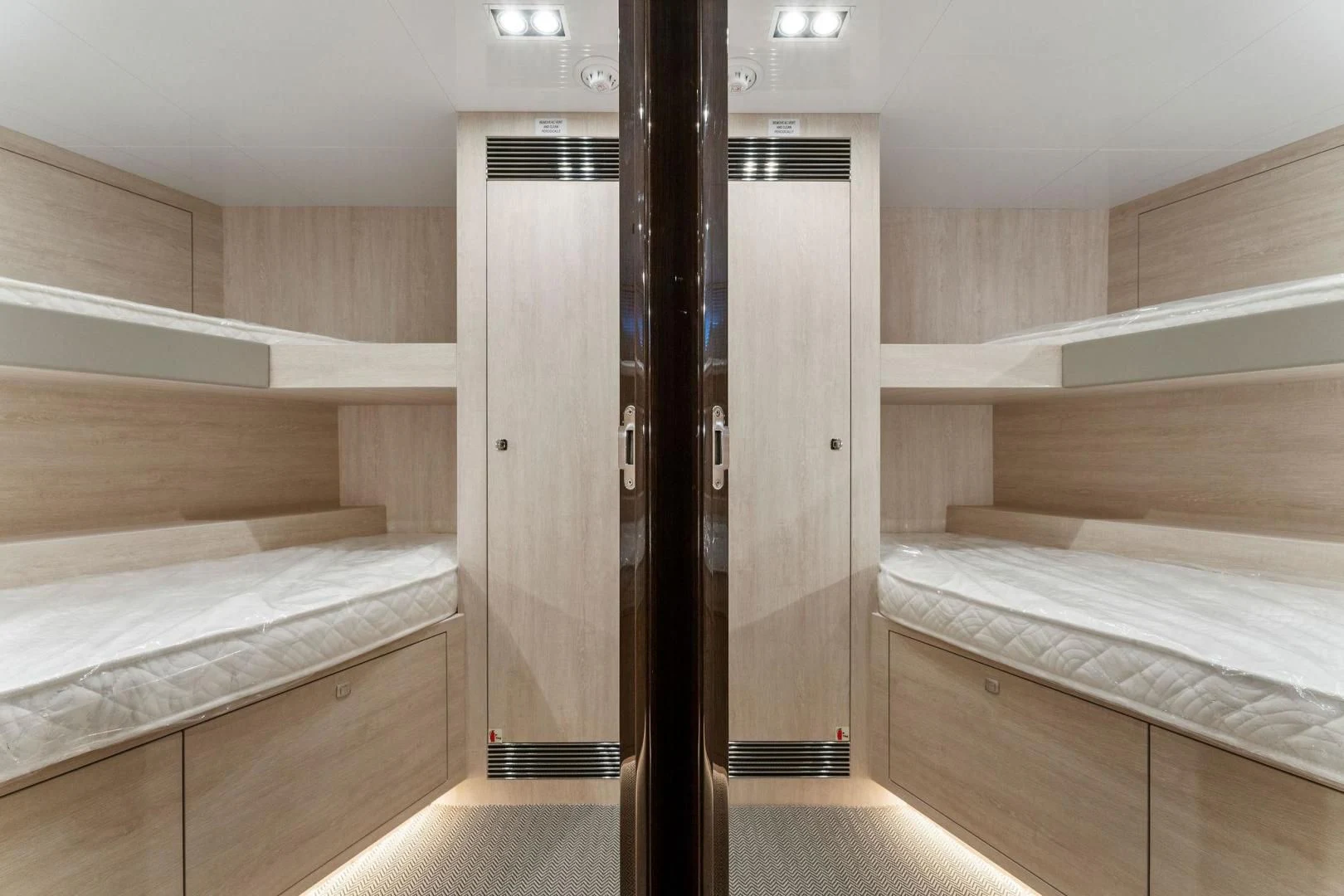 a room with bunk beds aboard PEARL Yacht for Sale